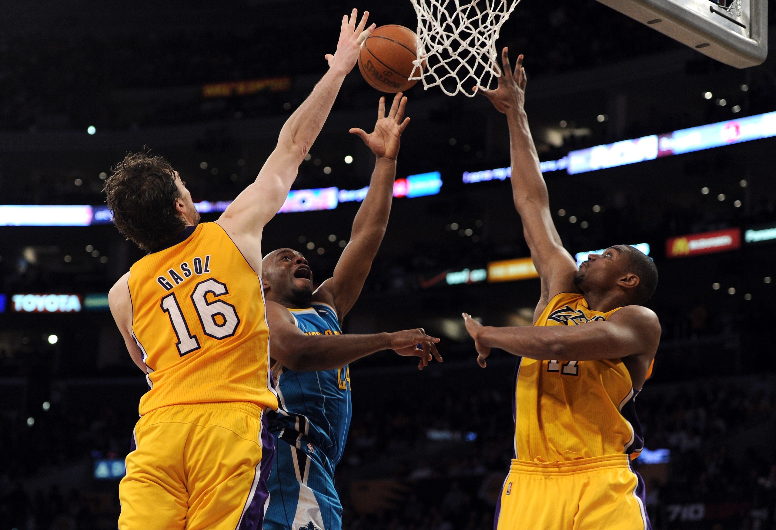 LOS ANGELES, CA - APRIL 26: Carl Landry #24 of the New Orleans Hornets goes up for a shot against Andrew Bynum #17 and Pau Gasol #16 of the Los Angeles Lakers in the third quarter in Game Five of the Western Conference Quarterfinals in the 2011 NBA Playo LOS ANGELES, CA - APRIL 26: Carl Landry #24 of the New Orleans Hornets goes up for a shot against Andrew Bynum #17 and Pau Gasol #16 of the Los Angeles Lakers in the third quarter in Game Five of the Western Conference Quarterfinals in the 2011 NBA Playo