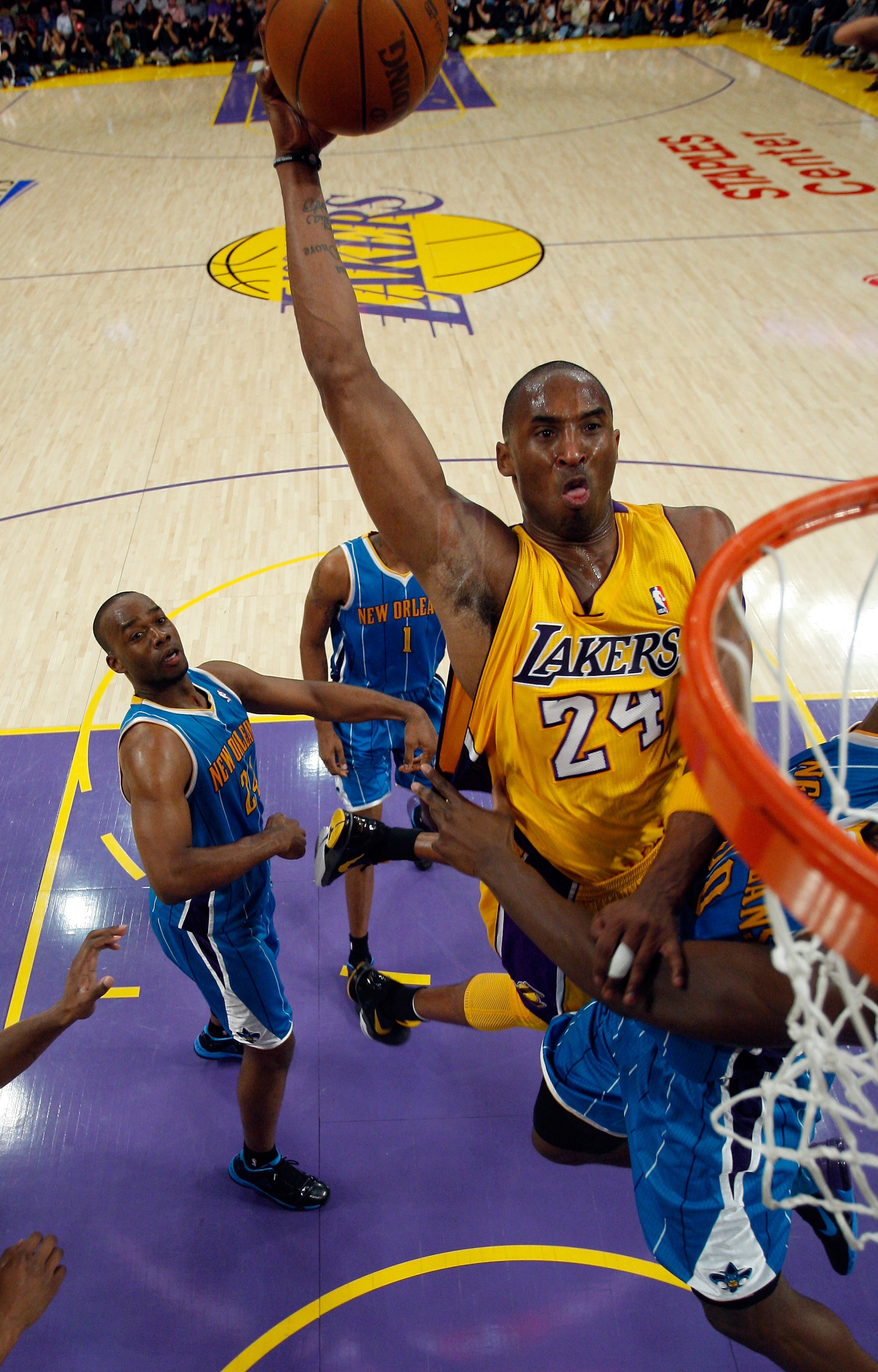 LOS ANGELES, CA - APRIL 26: Kobe Bryant #24 of the Los Angeles Lakers dunks the ball over Emeka Okafor #50 of the New Orleans Hornets in the second quarter in Game Five of the Western Conference Quarterfinals in the 2011 NBA Playoffs on April 26, 2011 at LOS ANGELES, CA - APRIL 26: Kobe Bryant #24 of the Los Angeles Lakers dunks the ball over Emeka Okafor #50 of the New Orleans Hornets in the second quarter in Game Five of the Western Conference Quarterfinals in the 2011 NBA Playoffs on April 26, 2011 at