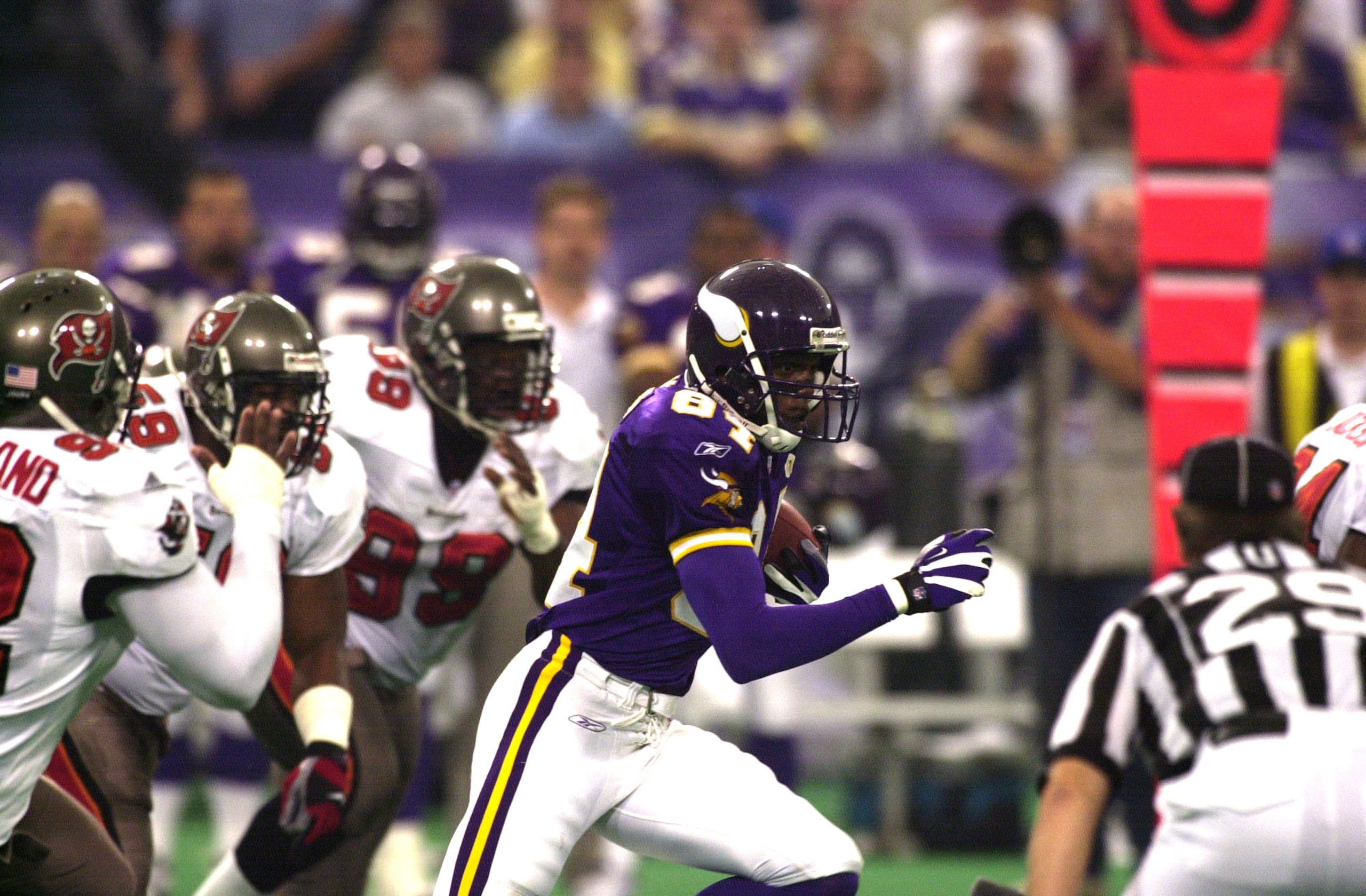 30 Sep 2001: Randy Moss #84 of the Minnesota Vikings is chased by Anthony McFarland #92 and Warren Sapp #99 of the Tampa Bay Buccaneers during the game at the Hubert H. Humphrey Metrodome in Minneapolis, Minnesota. The Vikings won 20-16. DIGITAL IMAGE Ma 30 Sep 2001: Randy Moss #84 of the Minnesota Vikings is chased by Anthony McFarland #92 and Warren Sapp #99 of the Tampa Bay Buccaneers during the game at the Hubert H. Humphrey Metrodome in Minneapolis, Minnesota. The Vikings won 20-16. DIGITAL IMAGE Ma
