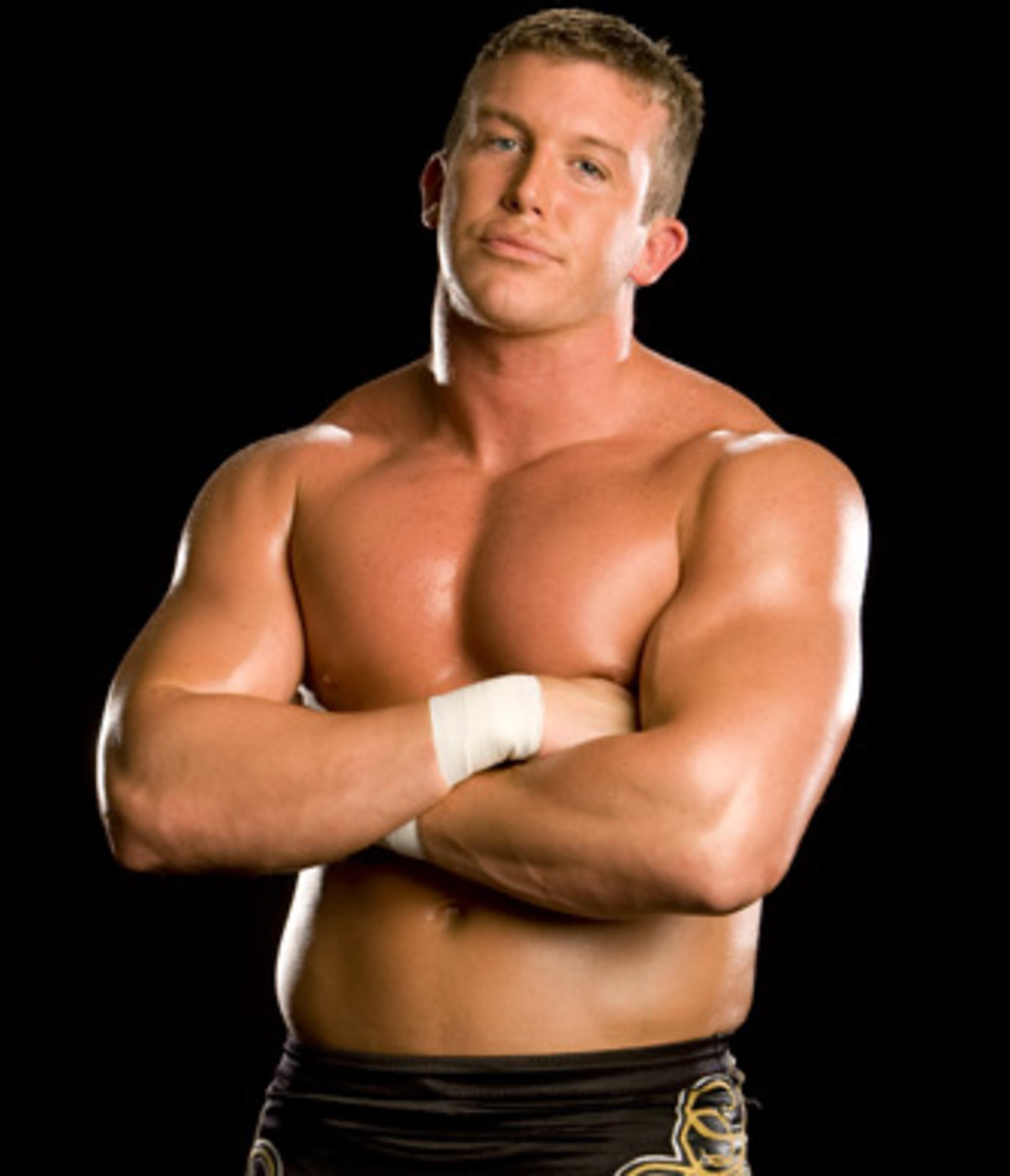 http://www.wwepictures.co.cc/wp-content/uploads/2011/03/WWE-Ted-DiBiase-Showing-His-Body-Muscle-.jpg