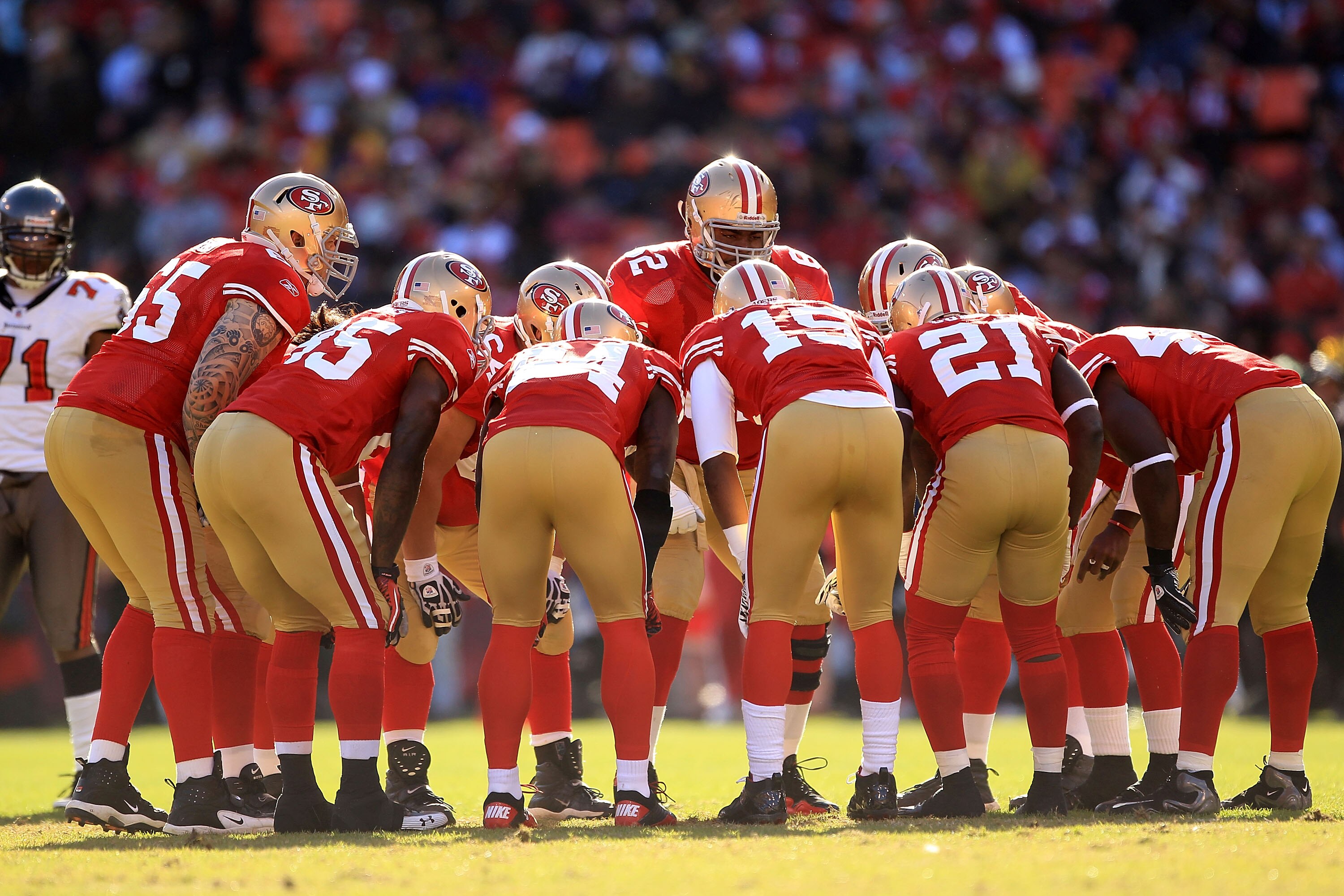 SAN FRANCISCO - NOVEMBER 21:  The San Francisco 49ers offense huddles together during their game against the Tampa Bay Buccaneers at Candlestick Park on November 21, 2010 in San Francisco, California.  (Photo by Ezra Shaw/Getty Images)