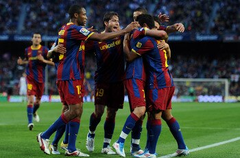 BARCELONA, SPAIN - APRIL 23:  David Villa (2nd R) of Barcelona celebrates scoring his sides opening goal with his teammates during the la Liga match between Barcelona and Osasuna at the Camp Nou stadium on April 23, 2011 in Barcelona, Spain.  (Photo by Ja