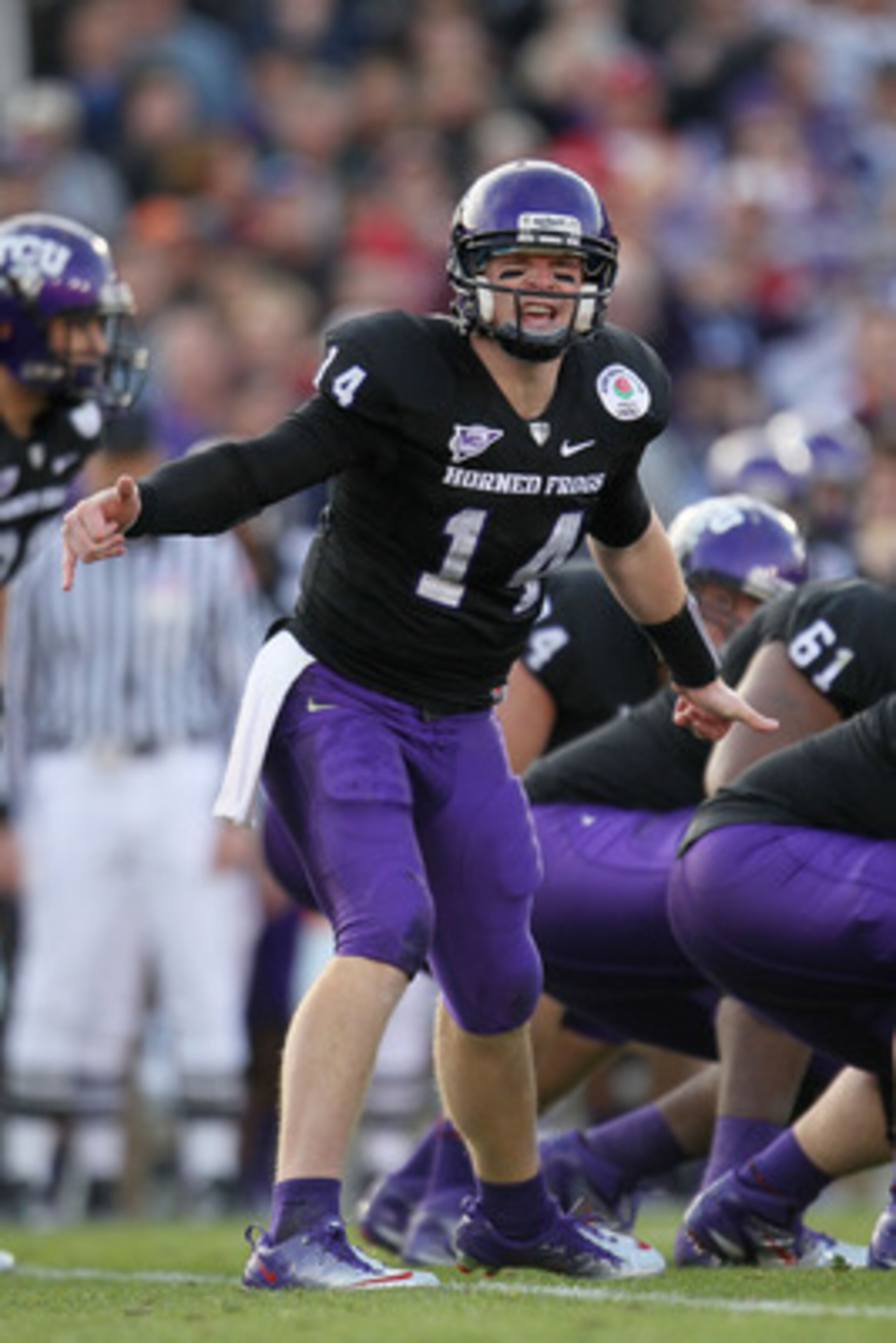 PASADENA, CA - JANUARY 01:  Quarterback Andy Dalton #14 of the TCU Horned Frogs signals a play against the Wisconsin Badgers during the 97th Rose Bowl game on January 1, 2011 in Pasadena, California.  (Photo by Jeff Gross/Getty Images)
