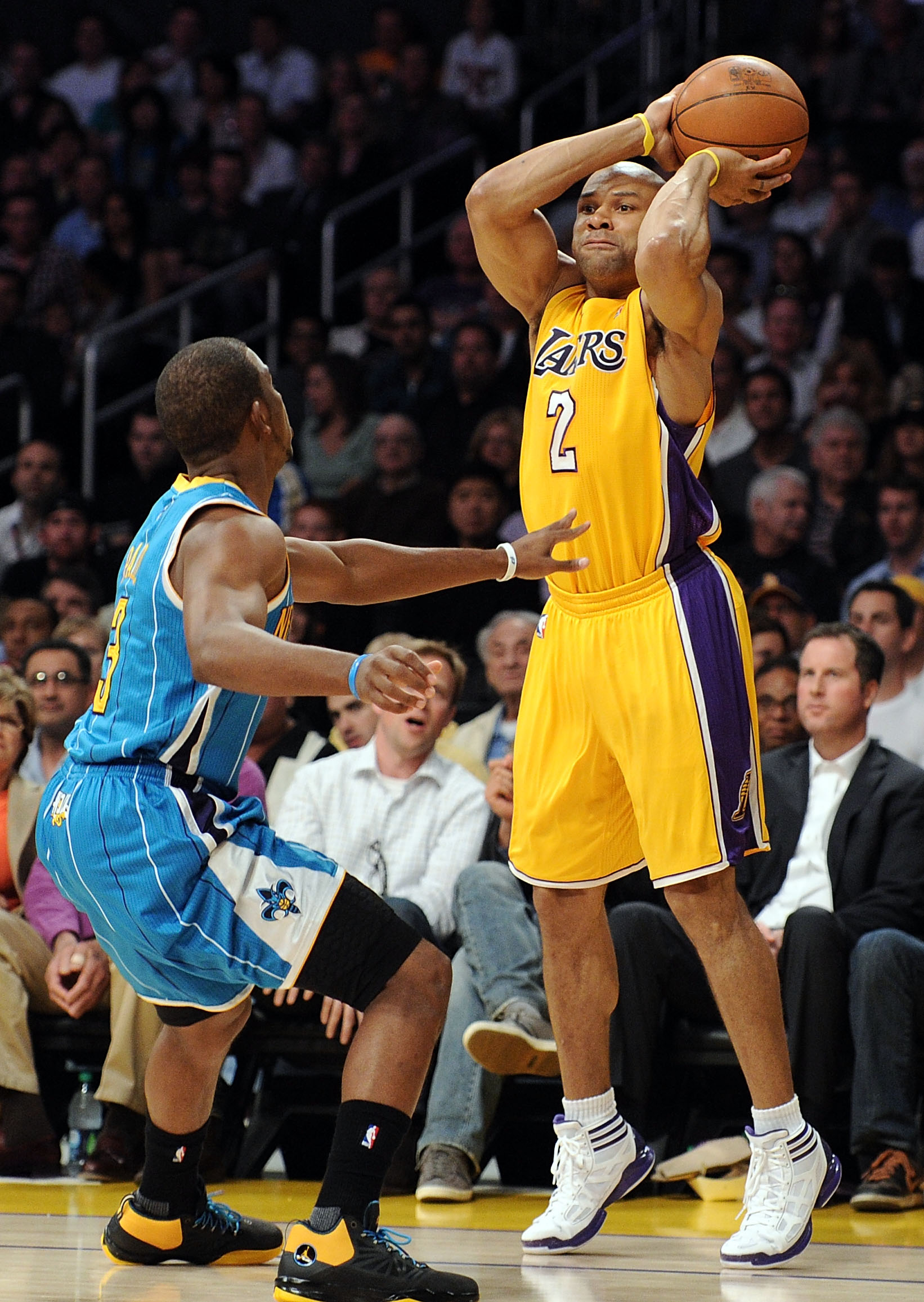 LOS ANGELES, CA - APRIL 20:  Derek Fisher #2 of the Los Angeles Lakers shoots over Chris Paul #3 of the New Orleans Hornets in Game Two of the Western Conference Quarterfinals in the 2011 NBA Playoffs on April 20, 2011 at Staples Center in Los Angeles, Ca