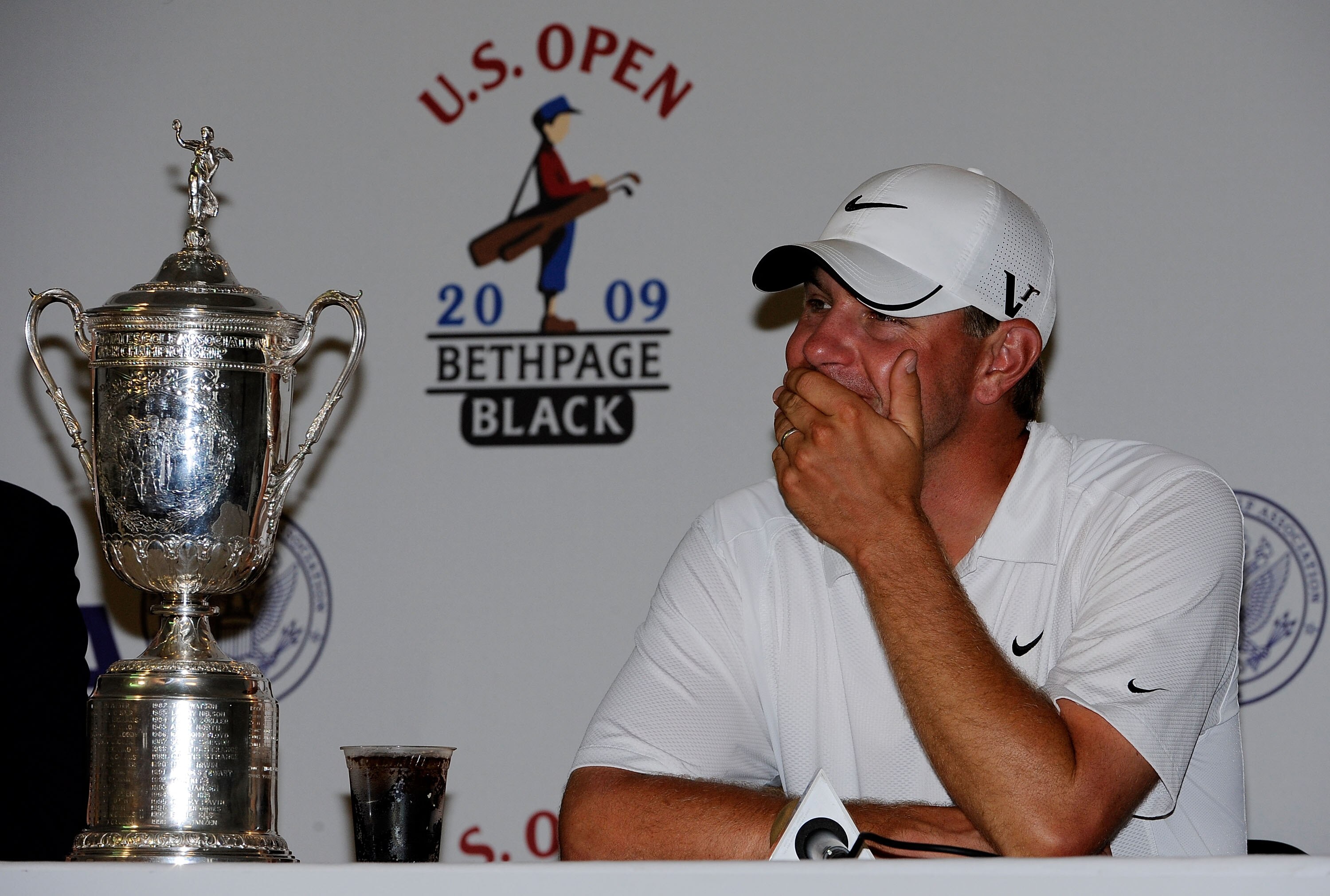 FARMINGDALE, NY - JUNE 22:  Lucas Glover speaks with the media after alongside the winner's trophy after his two-stroke victory at the 109th U.S. Open on the Black Course at Bethpage State Park on June 22, 2009 in Farmingdale, New York.  (Photo by Sam Gre