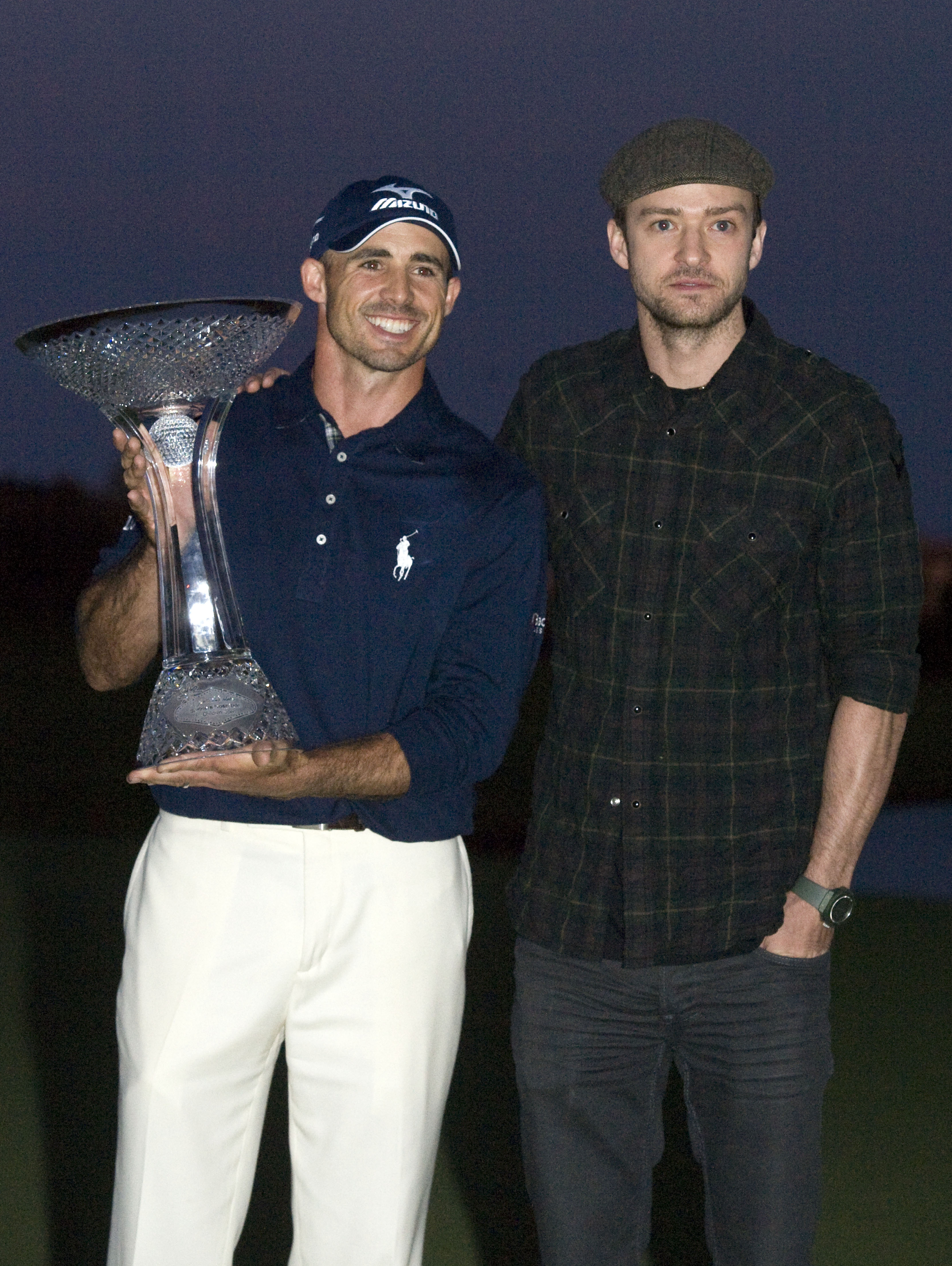 LAS VEGAS, NV - OCTOBER 24: Golfer Jonathan Byrd and Justin Timberlake pose with the trophy after Byrd hit a hole-in-one to win the tournament at the Justin Timberlake Shriners Hospitals for Children Open at TPC Sunderlin on October 24, 2010 in Las Vegas,