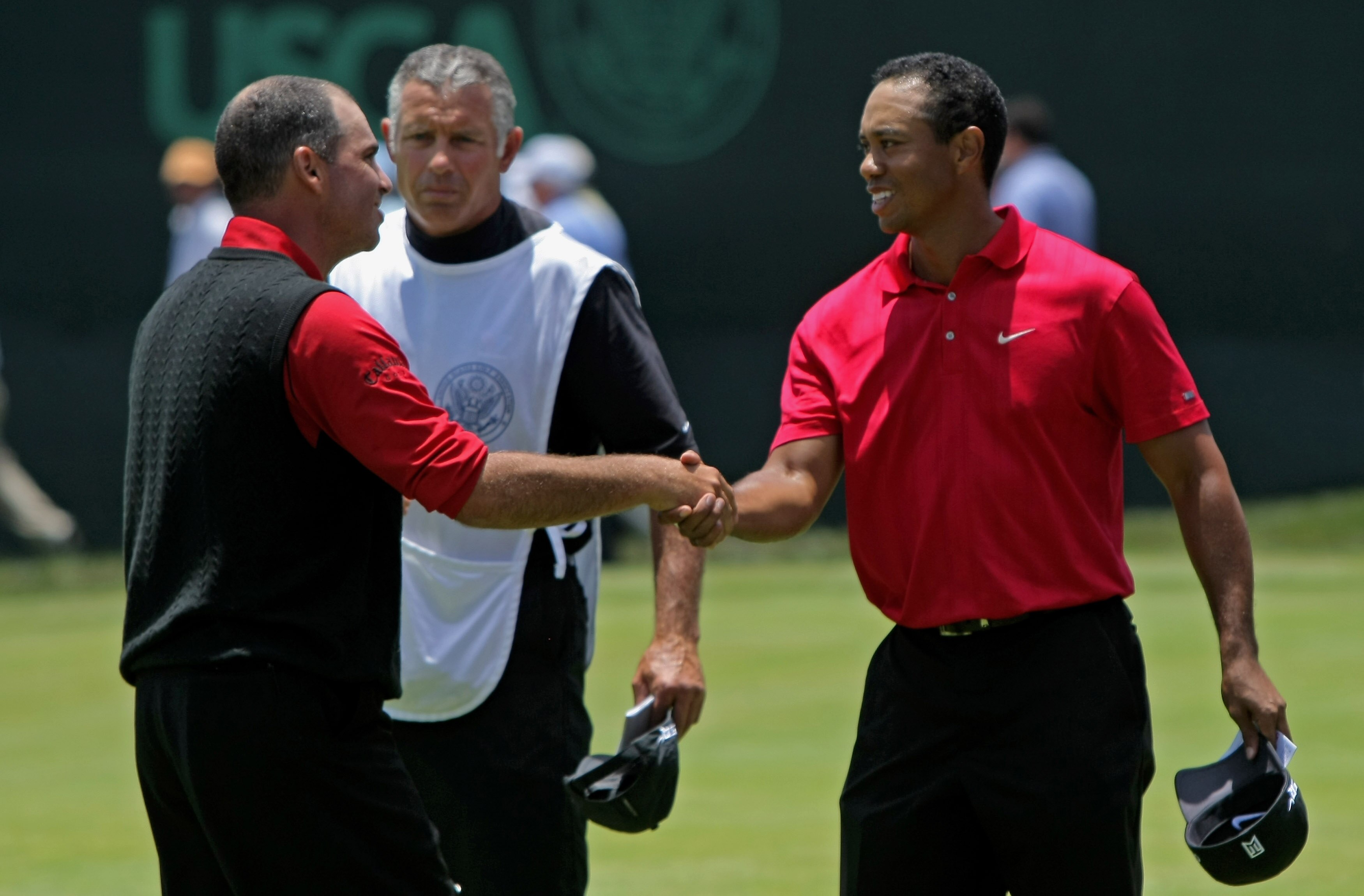 SAN DIEGO - JUNE 16:  Rocco Mediate (L) and Tiger Woods (R) shake hands on the 18th green as they played to a tie at the end of the playoff round of the 108th U.S. Open at the Torrey Pines Golf Course (South Course) on June 16, 2008 in San Diego, Californ