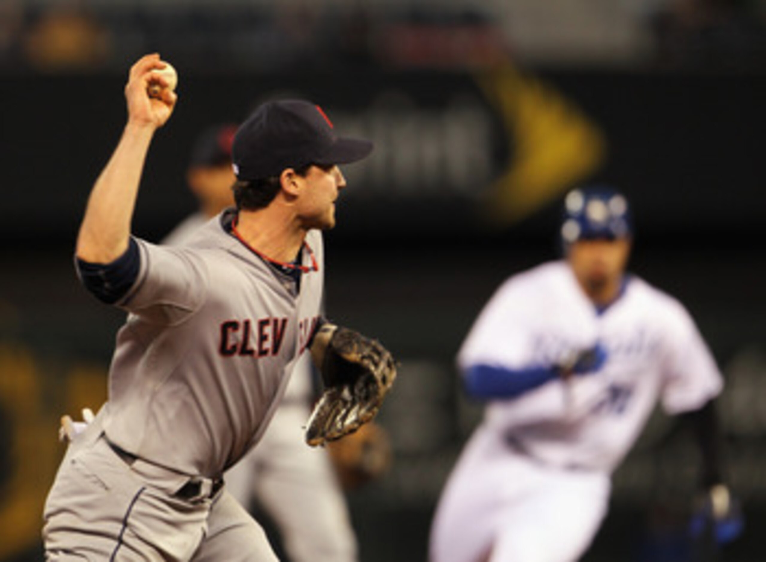 KANSAS CITY, MO - APRIL 20:  Jack Hannahan #9 of the Cleveland Indians throws toward first during the game against the Kansas City Royals on April 20, 2011 at Kauffman Stadium in Kansas City, Missouri.  (Photo by Jamie Squire/Getty Images)