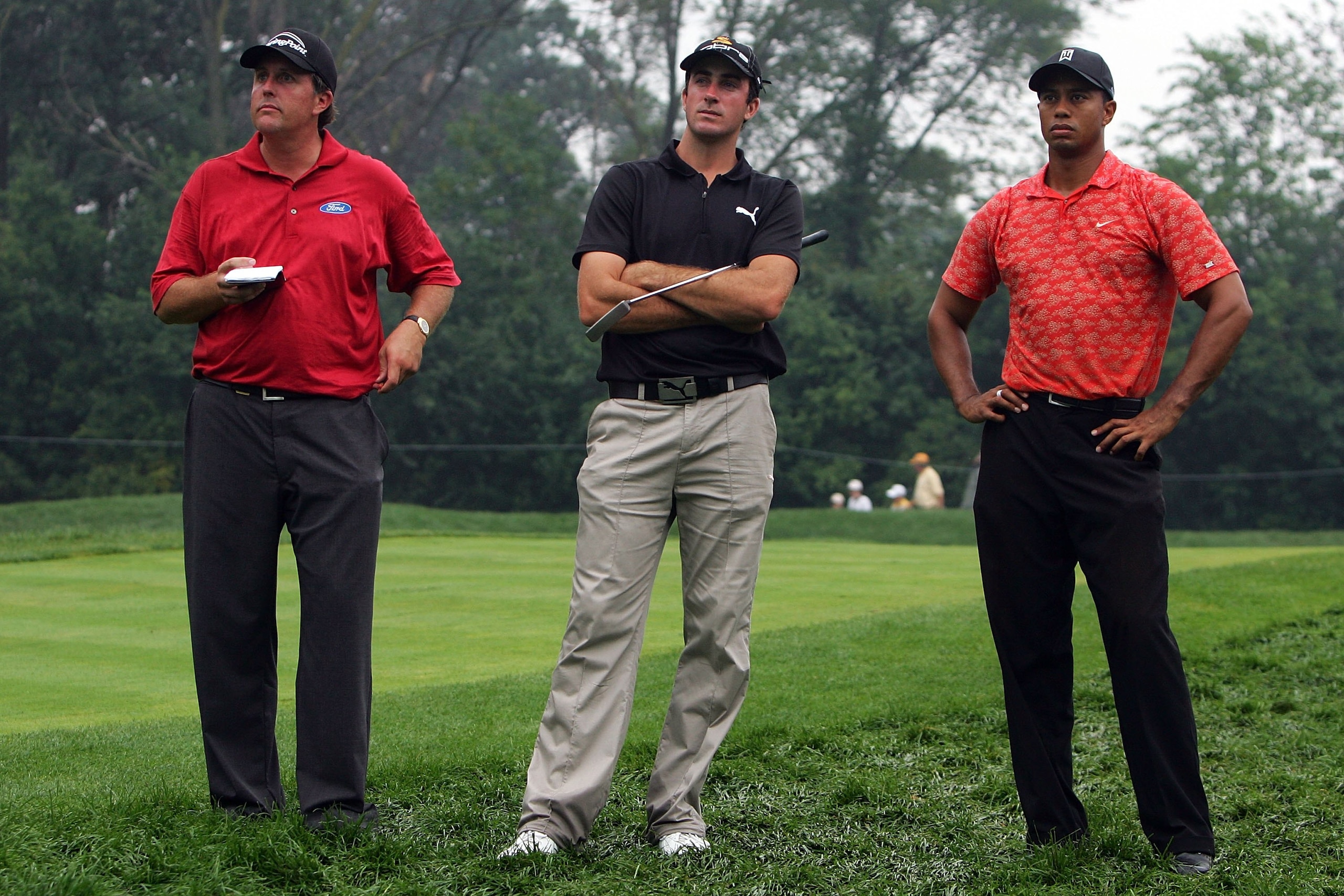MEDINAH, IL - AUGUST 18: Phil Mickelson, Geoff Ogilvy and Tiger Woods look on during the second round of the 2006 PGA Championship at Medinah Country Club on August 18, 2006 in Medinah, Illinois. (Photo by Jeff Gross/Getty Images) MEDINAH, IL - AUGUST 18: Phil Mickelson, Geoff Ogilvy and Tiger Woods look on during the second round of the 2006 PGA Championship at Medinah Country Club on August 18, 2006 in Medinah, Illinois. (Photo by Jeff Gross/Getty Images)