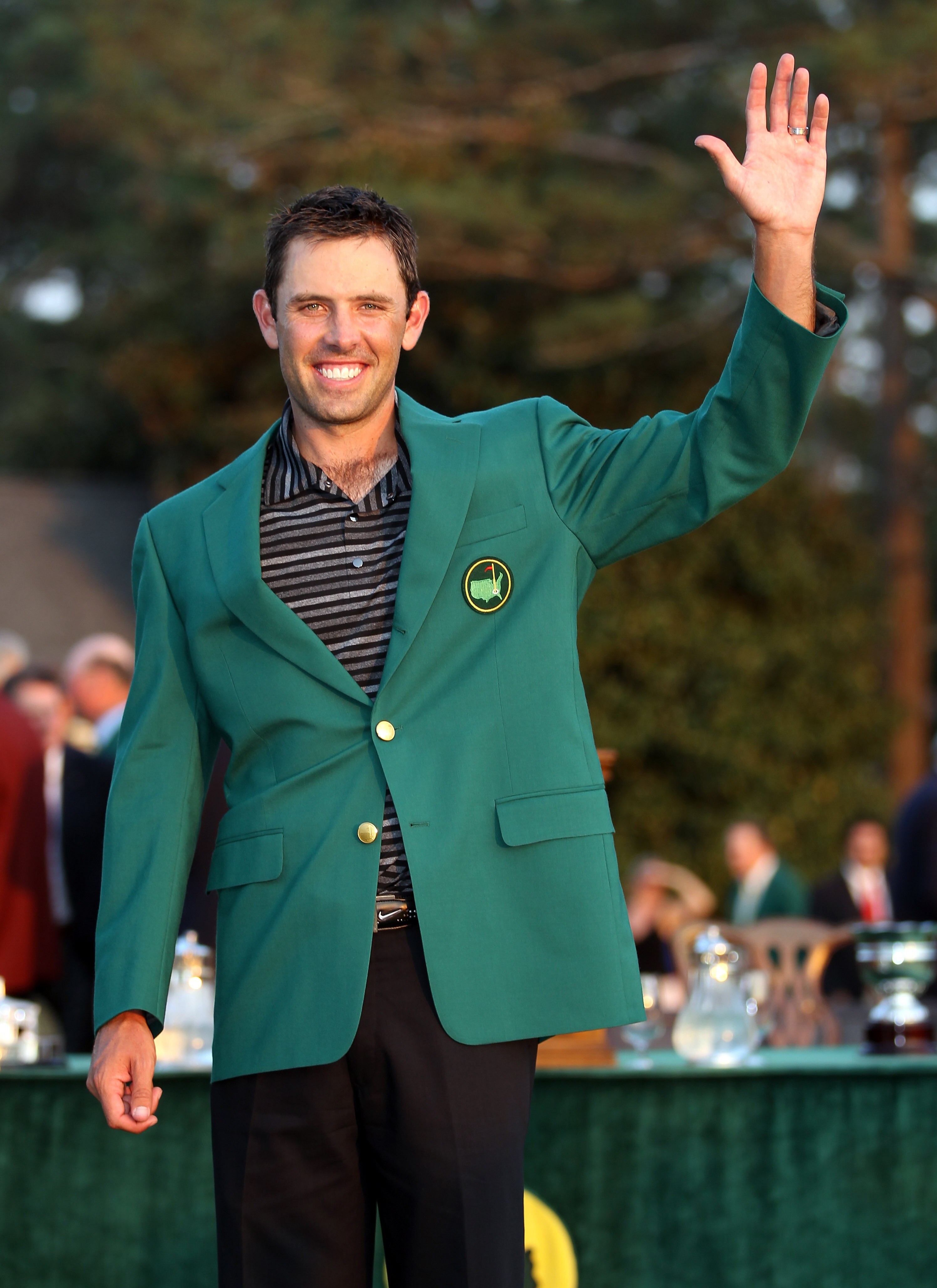 AUGUSTA, GA - APRIL 10:  Charl Schwartzel of South Africa is presented with his Green Jacket after winning the Masters after the final round of the 2011 Masters Tournament at Augusta National Golf Club on April 10, 2011 in Augusta, Georgia.  (Photo by Ros