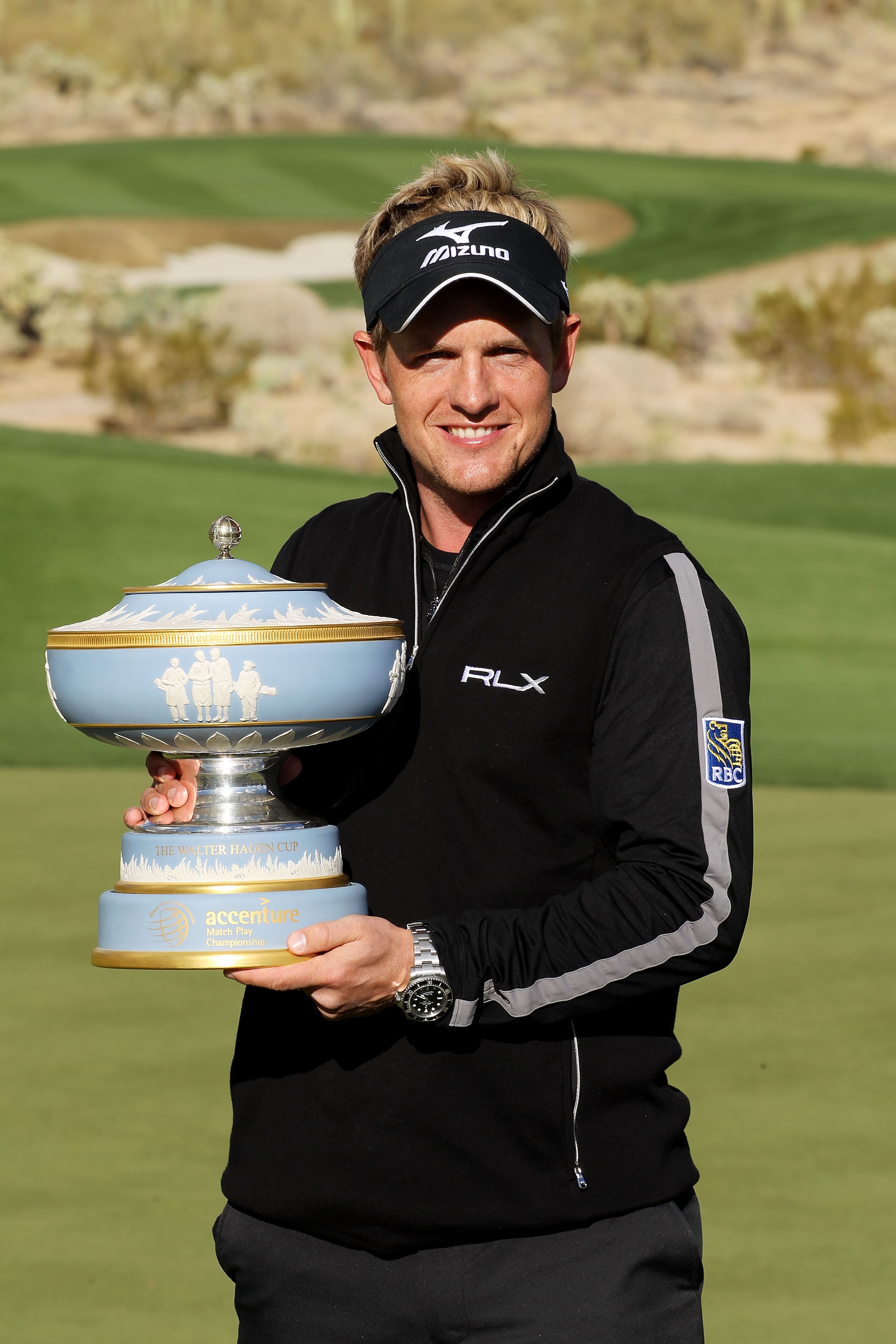 MARANA, AZ - FEBRUARY 27:  Luke Donald of England celebrates with The Walter Hagen Cup trophy after winning his match 3-up on the 16th hole during the final round of the Accenture Match Play Championship at the Ritz-Carlton Golf Club on February 27, 2011