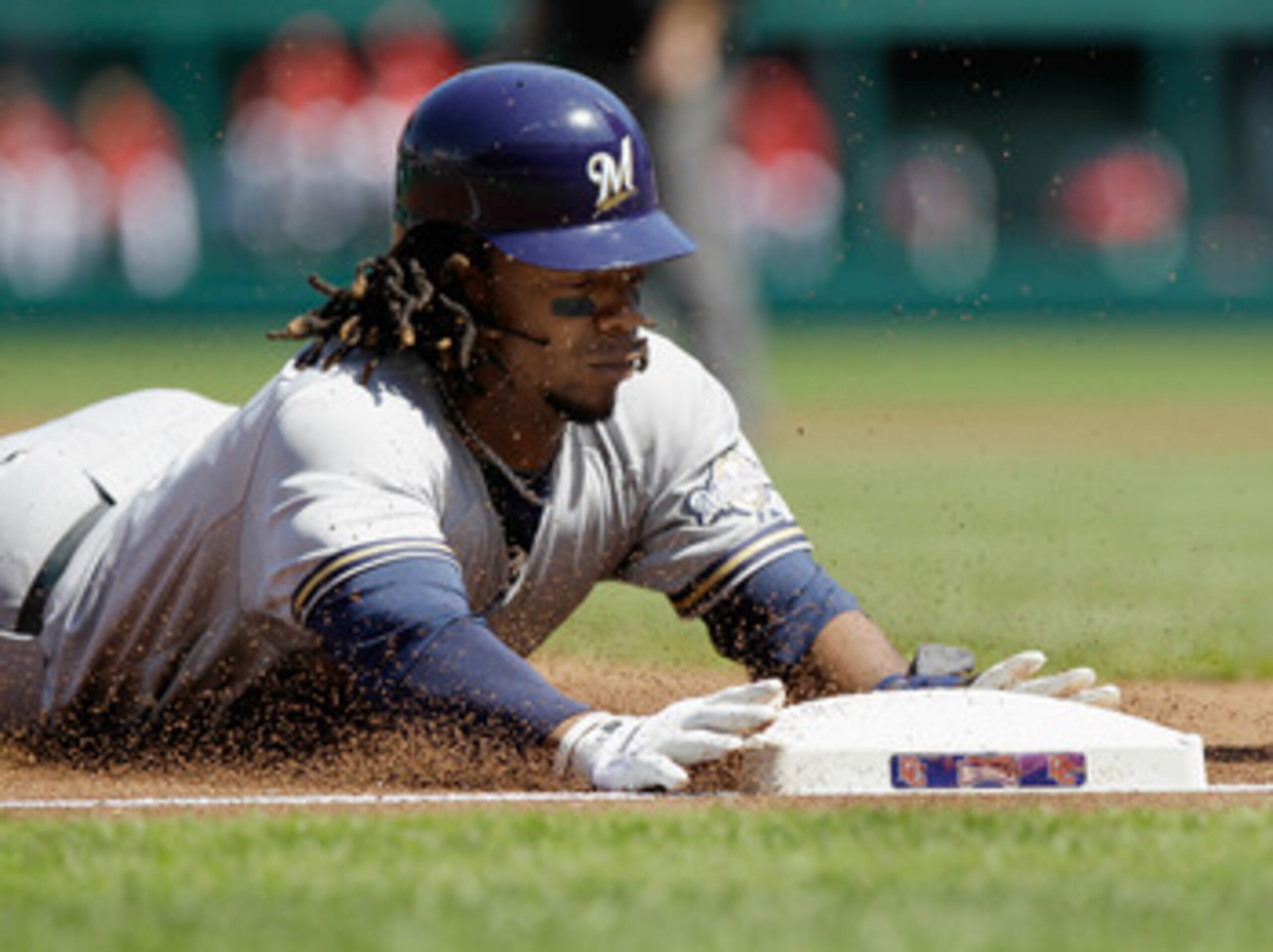 WASHINGTON, DC - APRIL 17:  Rickie Weeks #23 of the Milwaukee Brewers slides safely into third base during the first inning against the Washington Nationals during game one of a doubleheader at Nationals Park on April 17, 2011 in Washington, DC.  (Photo b