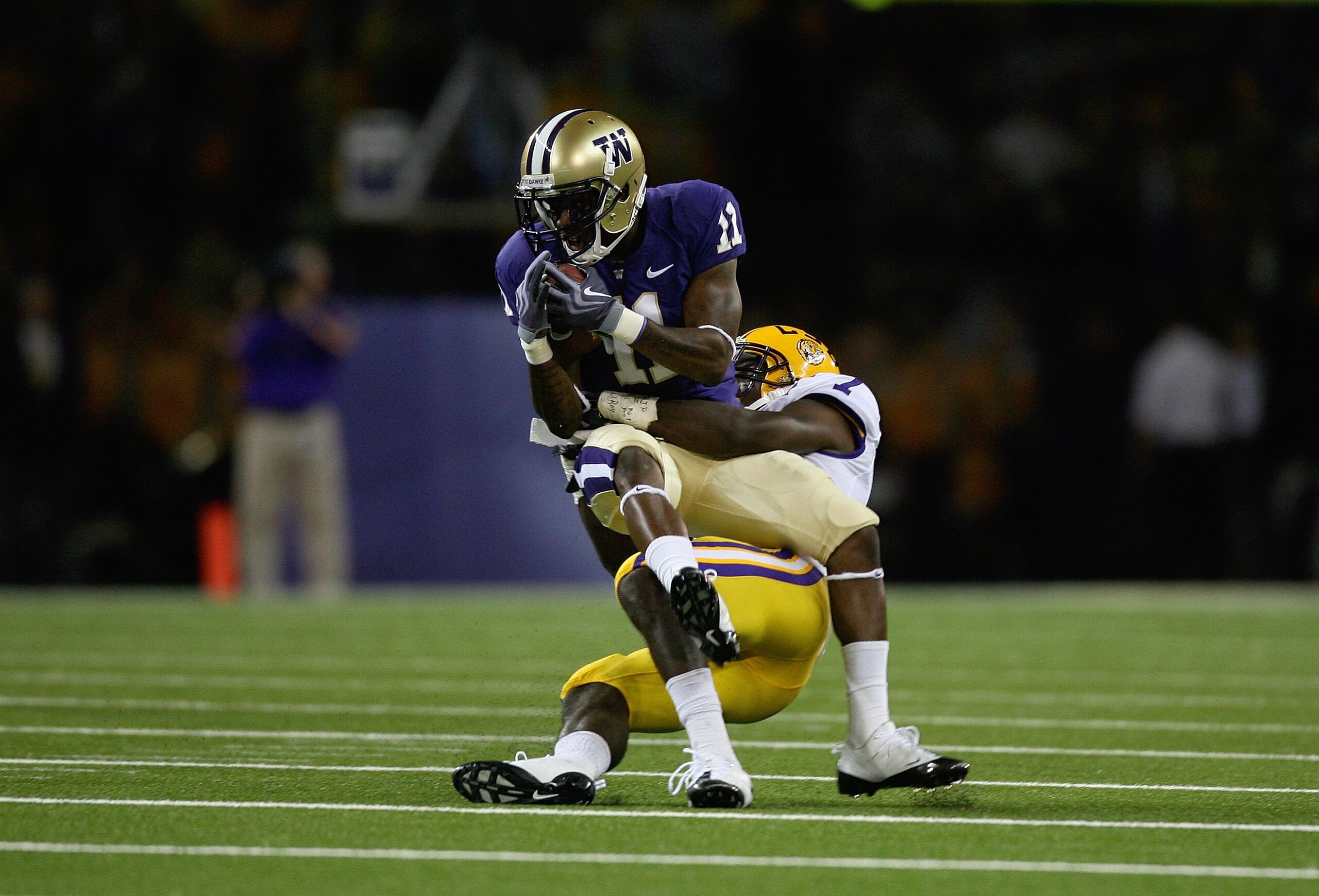 SEATTLE - SEPTEMBER 5: Patrick Peterson #7 of the LSU Tigers tackles D'Andre Goodwin #11 of the Washington Huskies during their game on September 5, 2009 at Husky Stadium in Seattle, Washington. The LSU Tigers defeated the Washington Huskies 31-23. (Phot SEATTLE - SEPTEMBER 5: Patrick Peterson #7 of the LSU Tigers tackles D'Andre Goodwin #11 of the Washington Huskies during their game on September 5, 2009 at Husky Stadium in Seattle, Washington. The LSU Tigers defeated the Washington Huskies 31-23. (Phot