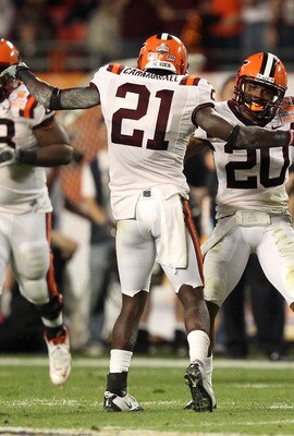 MIAMI, FL - JANUARY 03:  Rashad Carmichael #21 and Jayron Hosley #20 of the Virginai Tech Hokies celebrate after Hosley intercepted a pass in the second quarter against the Stanford Cardinal during the 2011 Discover Orange Bowl at Sun Life Stadium on Janu