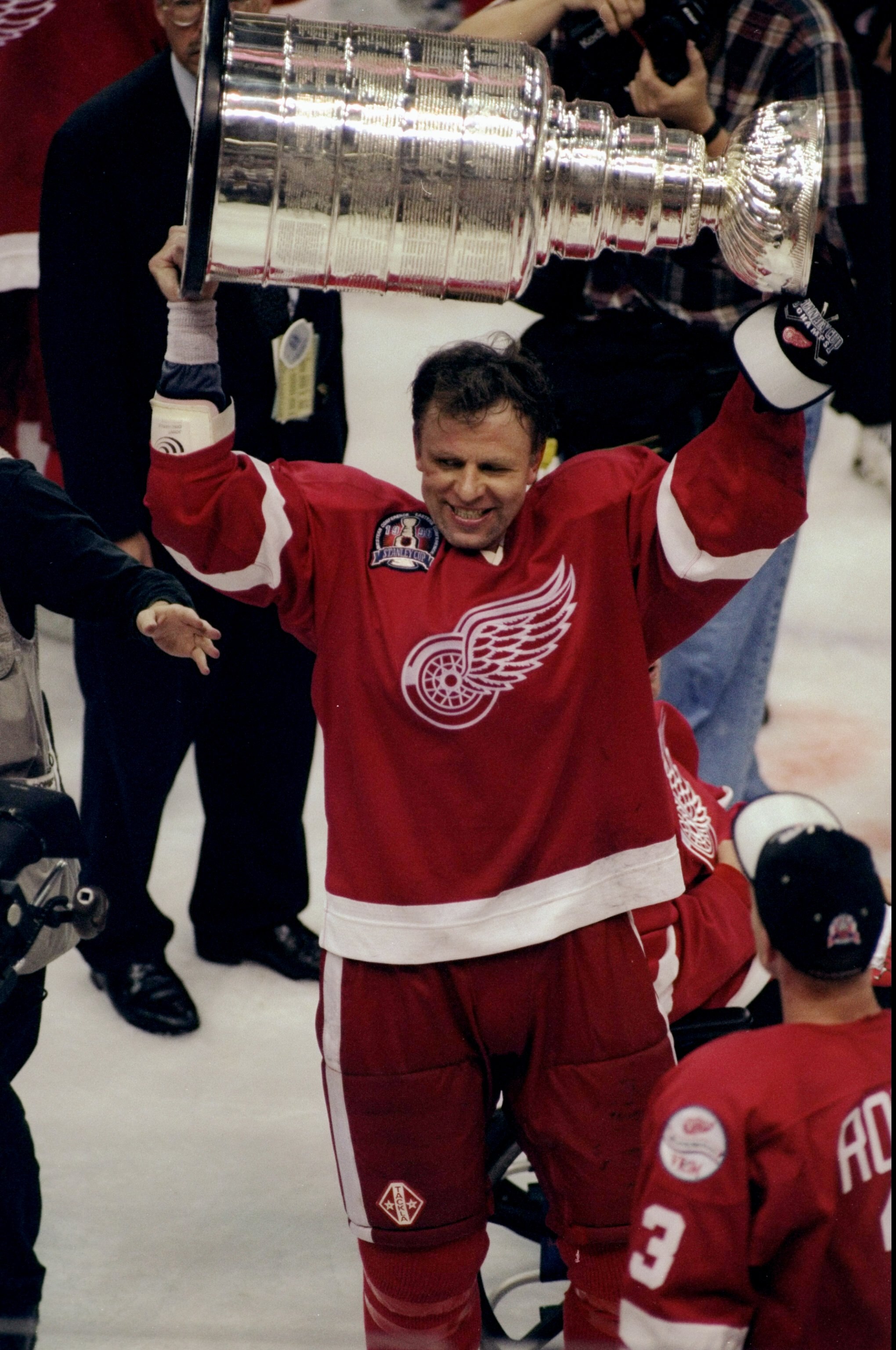 16 Jun 1998:  Viacheslav Fetisov #2 of the Detroit Red Wings holds up the Stanley Cup during the Stanley Cup Finals game against the Washington Capitals at the MCI Center in Washington, D. C.. The Red Wings defeated the Capitals 4-1. Mandatory Credit: Cra