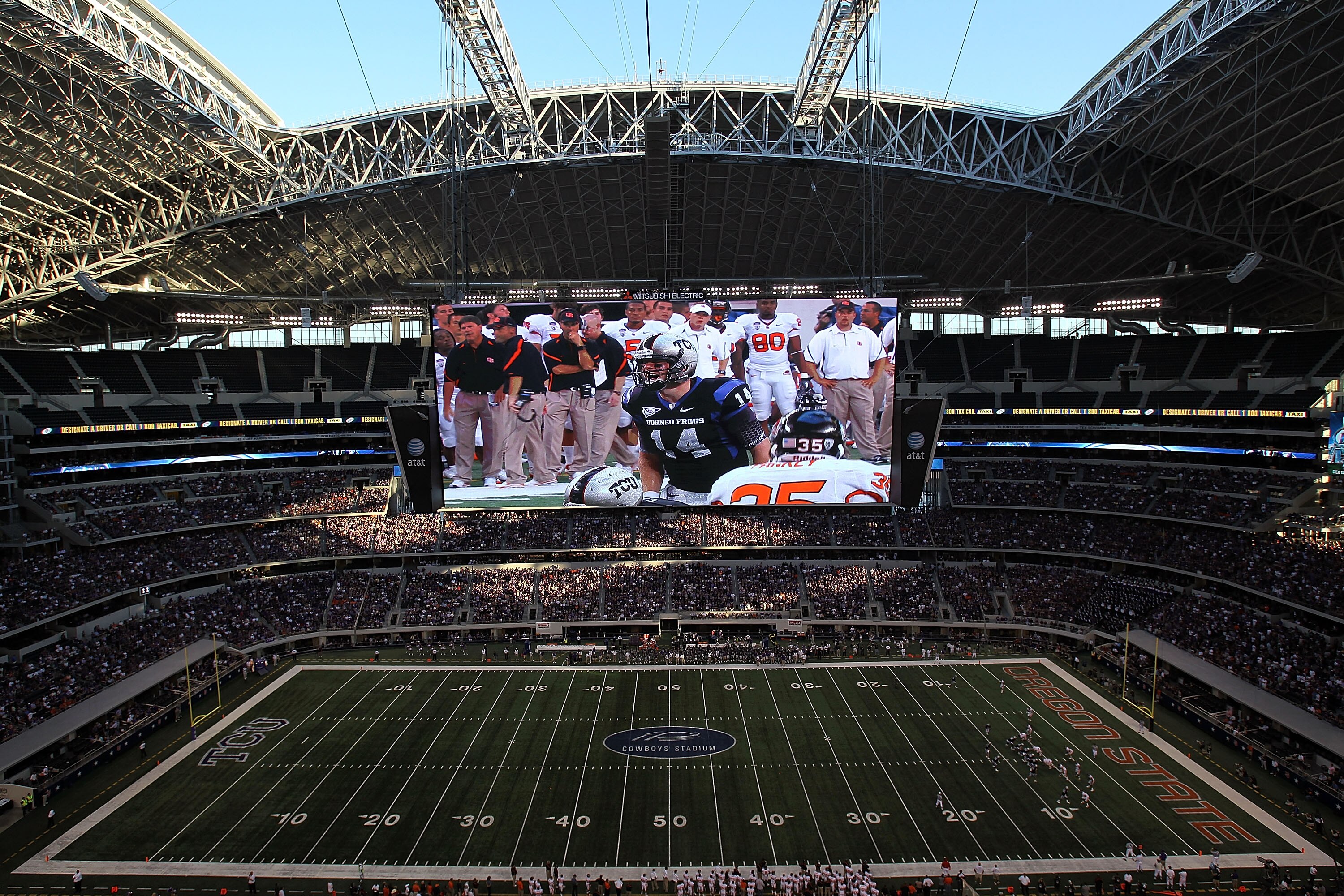 ARLINGTON, TX - SEPTEMBER 04:  Quarterback Andy Dalton #14 of the TCU Horned Frogs is shown on the video screen during play against the Oregon State Beavers at Cowboys Stadium on September 4, 2010 in Arlington, Texas.  (Photo by Ronald Martinez/Getty Imag