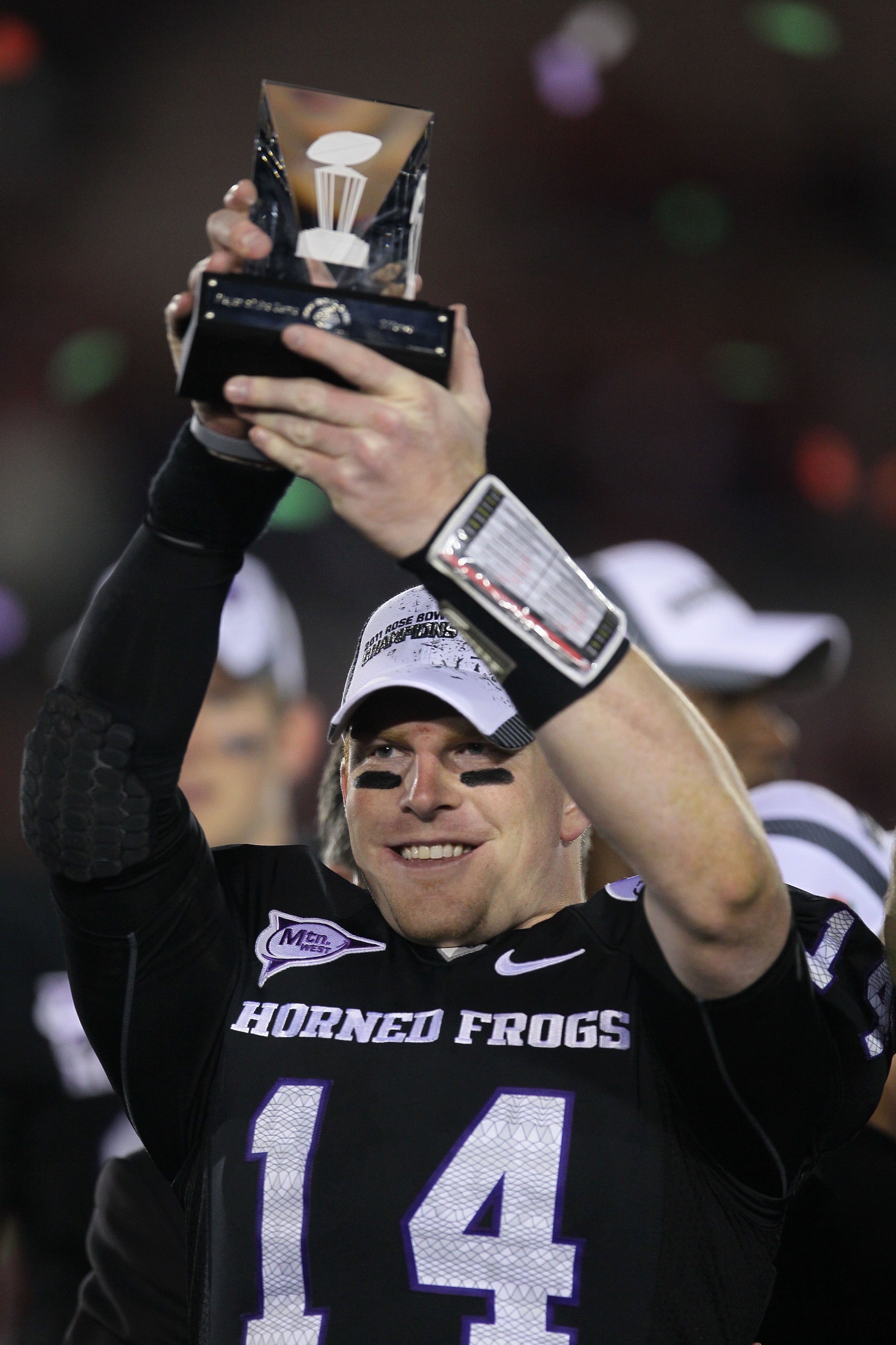 PASADENA, CA - JANUARY 01: Quarterback Andy Dalton #14 of the TCU Horned Frogs holds the offensive player of the game trophy after defeating the Wisconsin Badgers 21-19 in the 97th Rose Bowl game on January 1, 2011 in Pasadena, California. (Photo by Ste PASADENA, CA - JANUARY 01: Quarterback Andy Dalton #14 of the TCU Horned Frogs holds the offensive player of the game trophy after defeating the Wisconsin Badgers 21-19 in the 97th Rose Bowl game on January 1, 2011 in Pasadena, California. (Photo by Ste