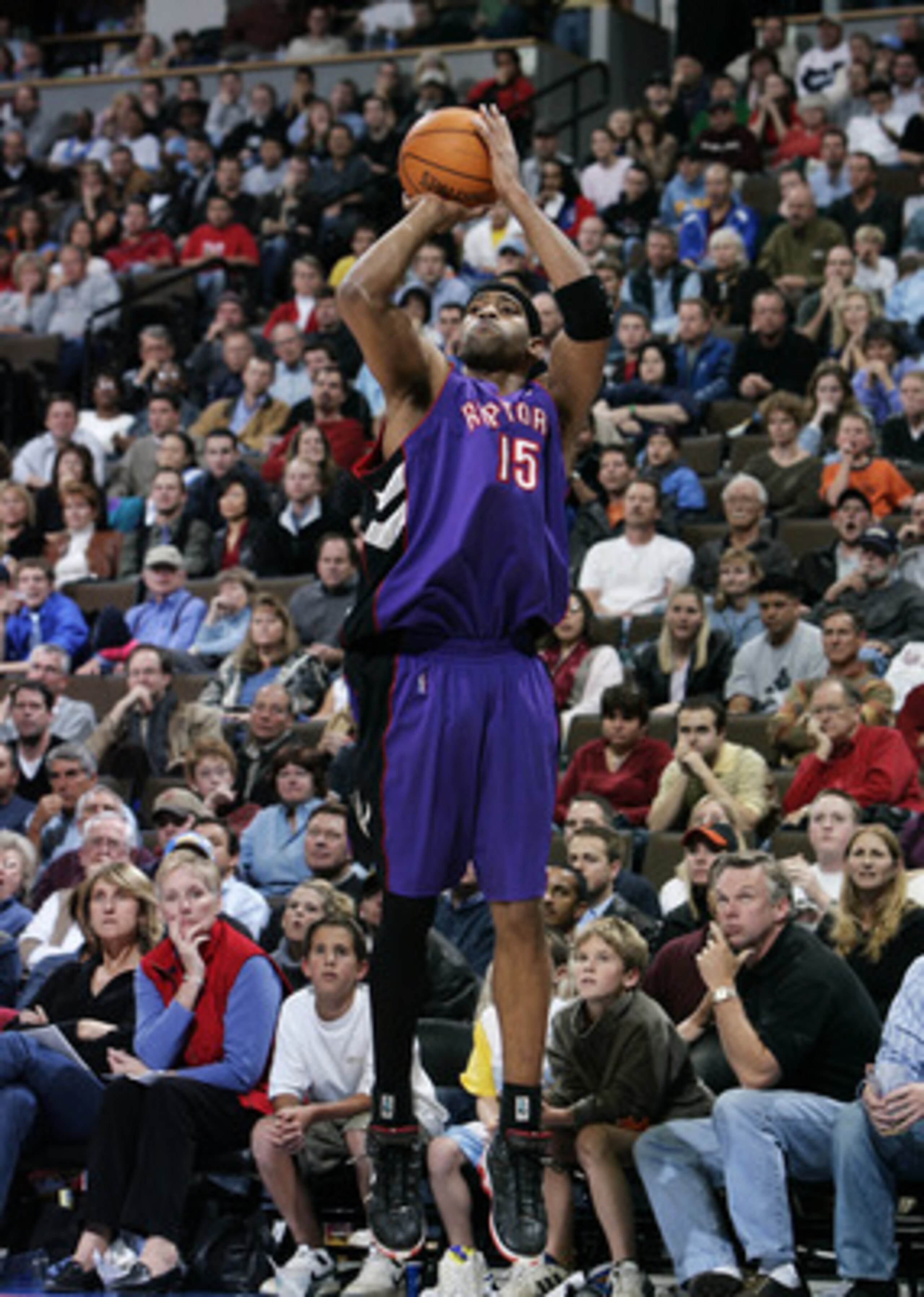 DENVER - NOVEMBER 17:  Vince Carter #15 of the Toronto Raptors takes a shot from the outside against the Denver Nuggets during the second half of NBA action on November 17, 2004 at the Pepsi Center in Denver, Colorado.  The Nuggets won the game 112-106.