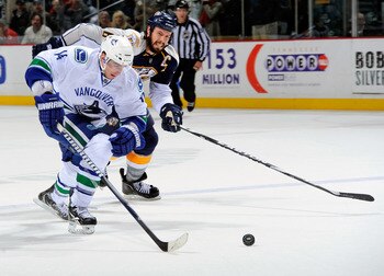 NASHVILLE, TN - MARCH 29:  Alexandre Burrows #14 of the Vancouver Canucks outskates Shea Weber #6 of the Nashville Predators to score a goal on the breakaway on March 29, 2011 at the Bridgestone Arena in Nashville, Tennessee.  (Photo by Frederick Breedon/