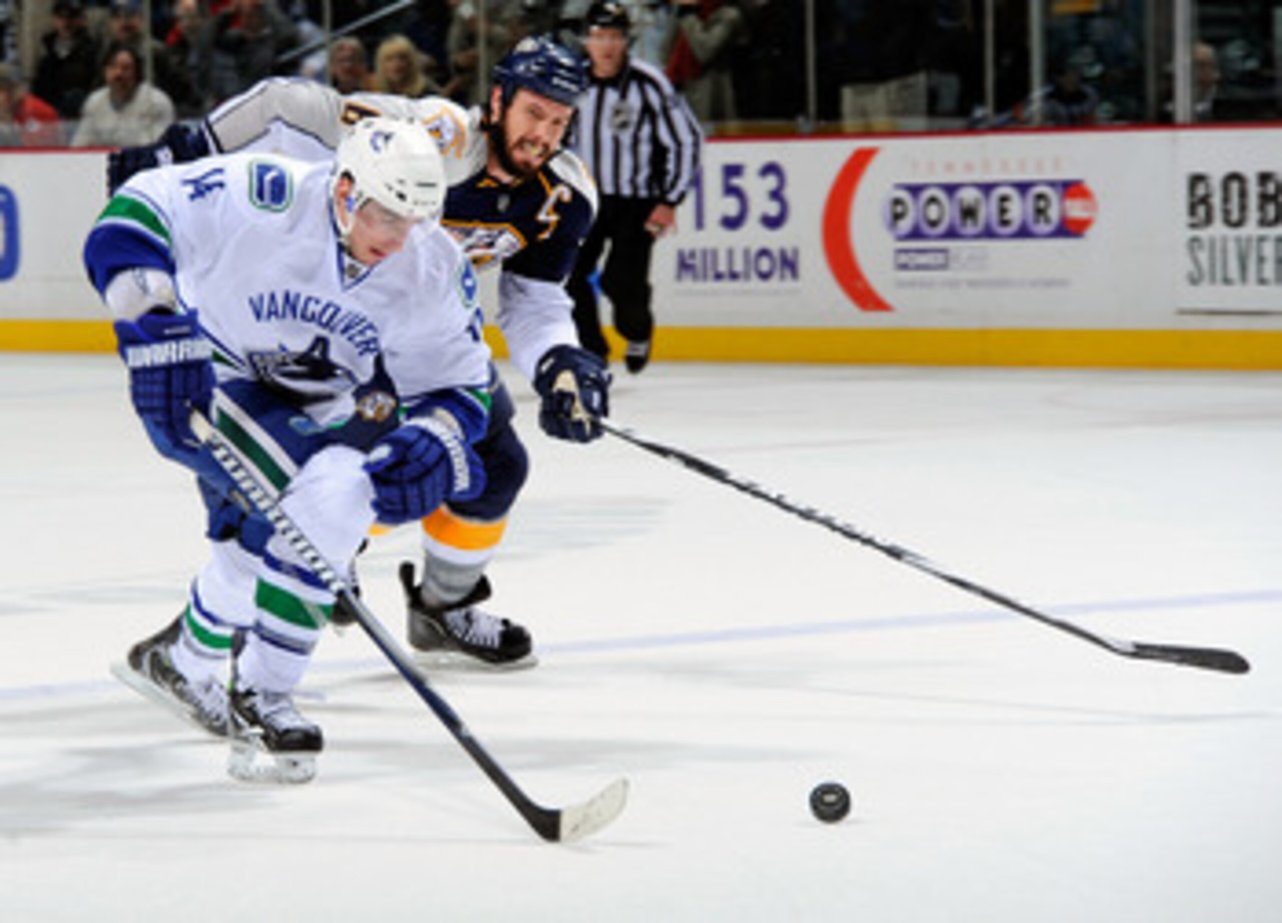 NASHVILLE, TN - MARCH 29:  Alexandre Burrows #14 of the Vancouver Canucks outskates Shea Weber #6 of the Nashville Predators to score a goal on the breakaway on March 29, 2011 at the Bridgestone Arena in Nashville, Tennessee.  (Photo by Frederick Breedon/