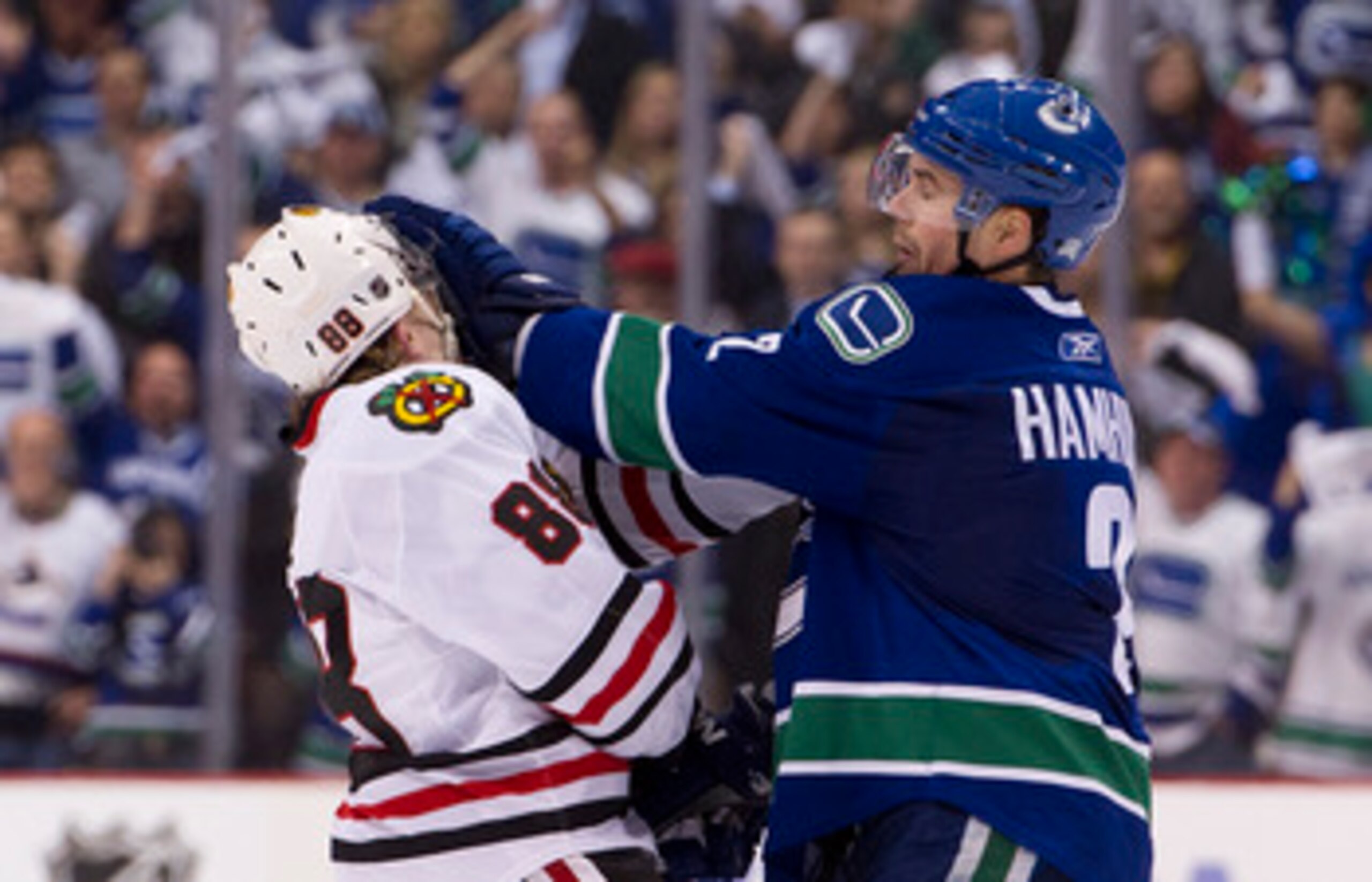 VANCOUVER, CANADA - APRIL 13: Dan Hamhuis #2 of the Vancouver Canucks gives Patrick Kane #88 of the Chicago Blackhawks a push to the face during the third period in Game One of the Western Conference Quarterfinals during the 2011 NHL Stanley Cup Playoffs