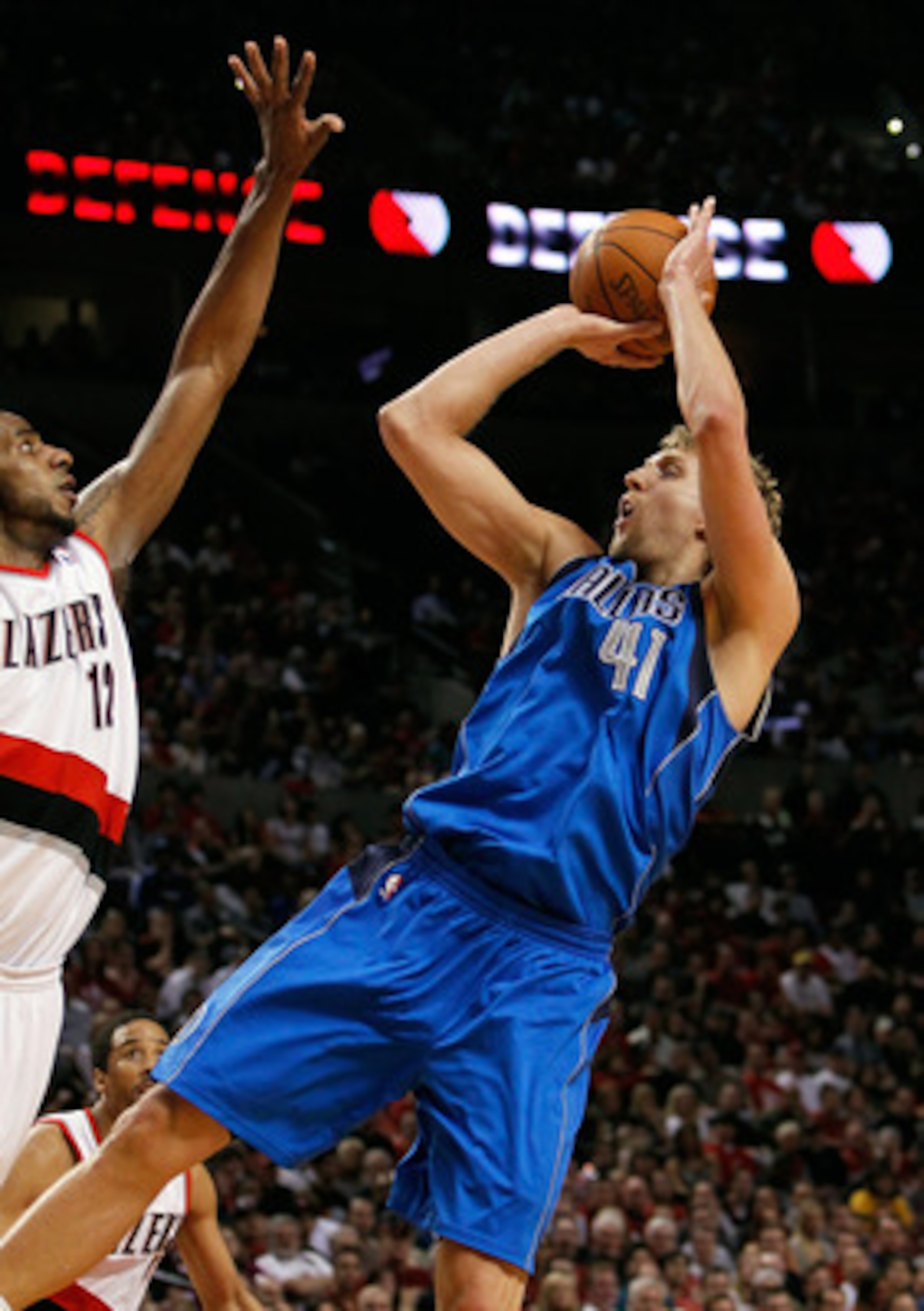 PORTLAND, OR - APRIL 23:  LaMarcus Aldrdige #12 of the Portland Trail Blazers defends Dirk Nowitzki #41 of the Dallas Mavericks in Game Four of the Western Conference Quarterfinals in the 2011 NBA Playoffs on April 23, 2011 at the Rose Garden in Portland,