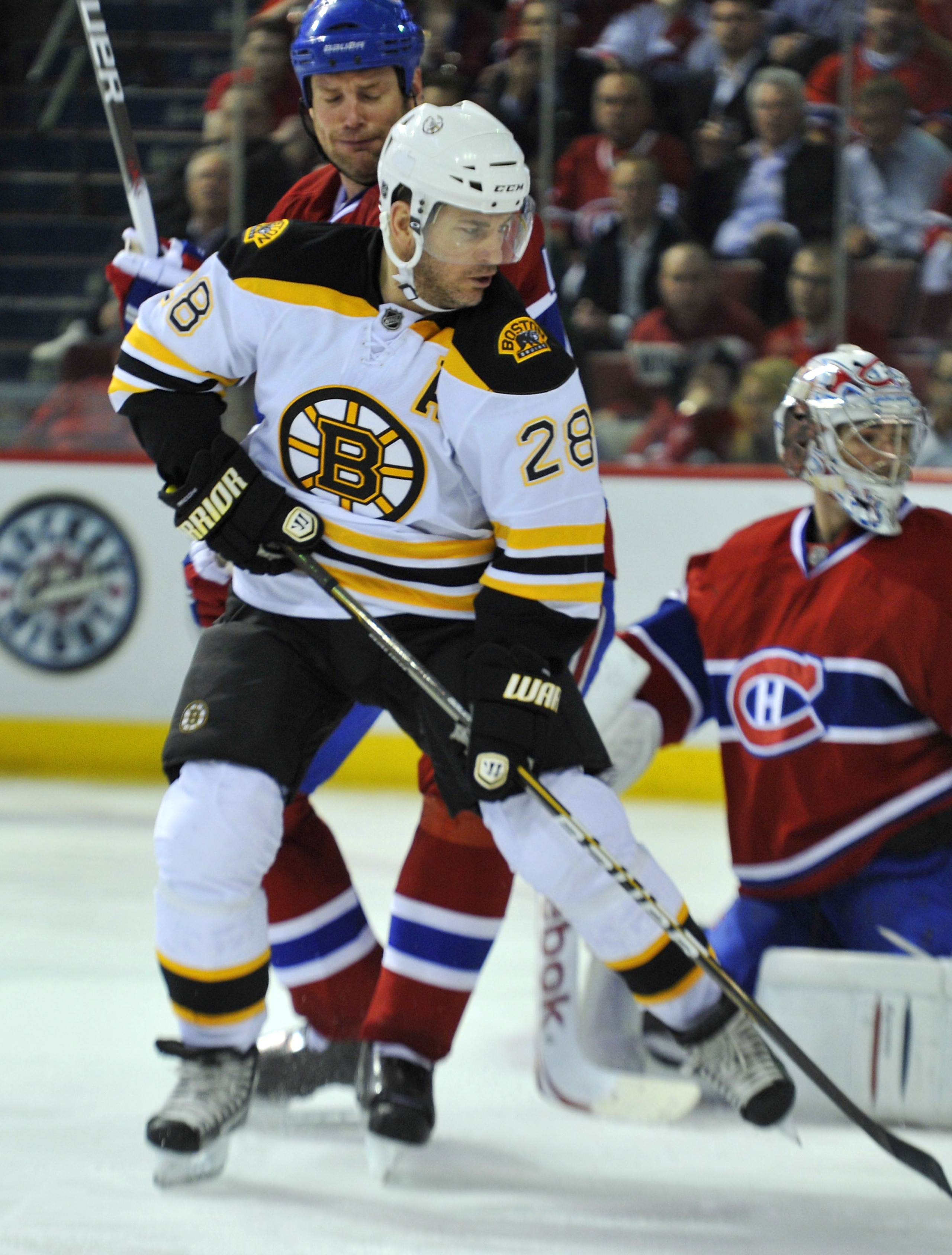 MONTREAL, CANADA - APRIL 18: Mark Recchi #28 of the Boston Bruins battles for position with Hal Gill #75 of the Montreal Canadiens out front of teammate Carey Price #31 in Game Three of the Eastern Conference Quarterfinals during the 2011 NHL Stanley Cup MONTREAL, CANADA - APRIL 18: Mark Recchi #28 of the Boston Bruins battles for position with Hal Gill #75 of the Montreal Canadiens out front of teammate Carey Price #31 in Game Three of the Eastern Conference Quarterfinals during the 2011 NHL Stanley Cup