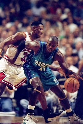 13 May 1998: Glen Rice of the Charlotte Hornets dribbles the ball as Scottie Pippen of the Chicago Bulls tries to block at the United Center in Chicago, Illinios. The Bulls defeated the Hornets 93-84. Mandatory Credit: Jonathan Daniel  /Allsport