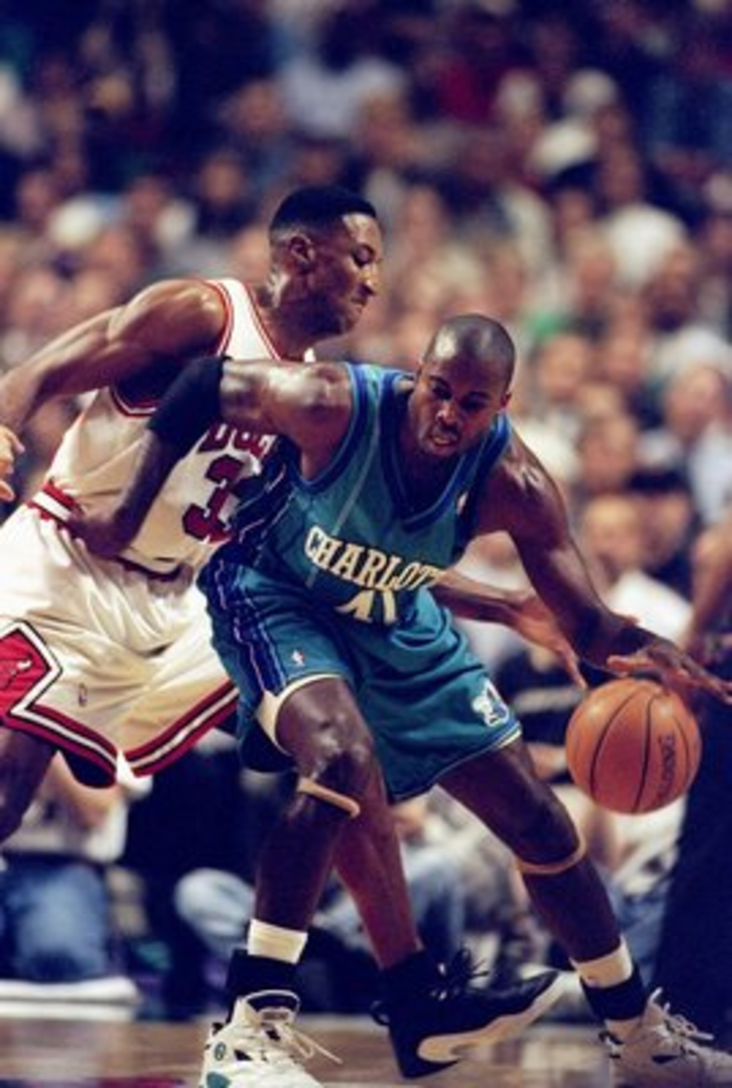 13 May 1998: Glen Rice of the Charlotte Hornets dribbles the ball as Scottie Pippen of the Chicago Bulls tries to block at the United Center in Chicago, Illinios. The Bulls defeated the Hornets 93-84. Mandatory Credit: Jonathan Daniel  /Allsport