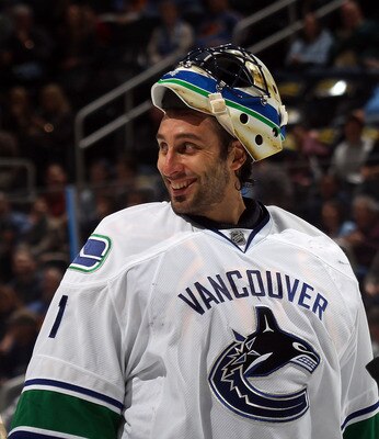 ATLANTA, GA - MARCH 25: Roberto Luongo #1 of the Vancouver Canucks responds to a comment by Dustin Byfuglien #33 of the Atlanta Thrashers during a timeout at the Philips Arena on March 25, 2011 in Atlanta, Georgia.  (Photo by Bruce Bennett/Getty Images)