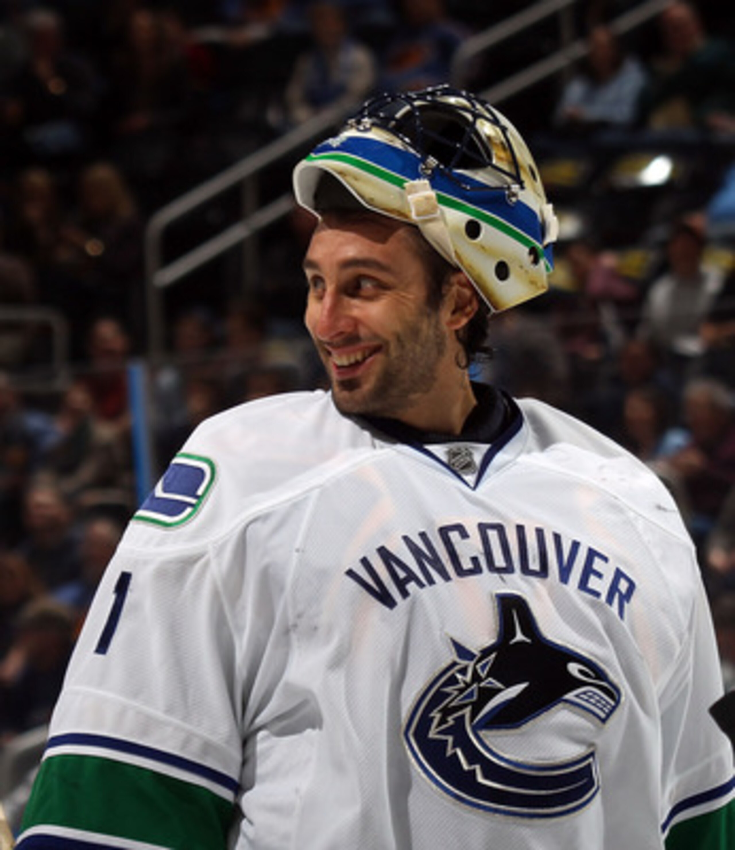ATLANTA, GA - MARCH 25: Roberto Luongo #1 of the Vancouver Canucks responds to a comment by Dustin Byfuglien #33 of the Atlanta Thrashers during a timeout at the Philips Arena on March 25, 2011 in Atlanta, Georgia.  (Photo by Bruce Bennett/Getty Images)
