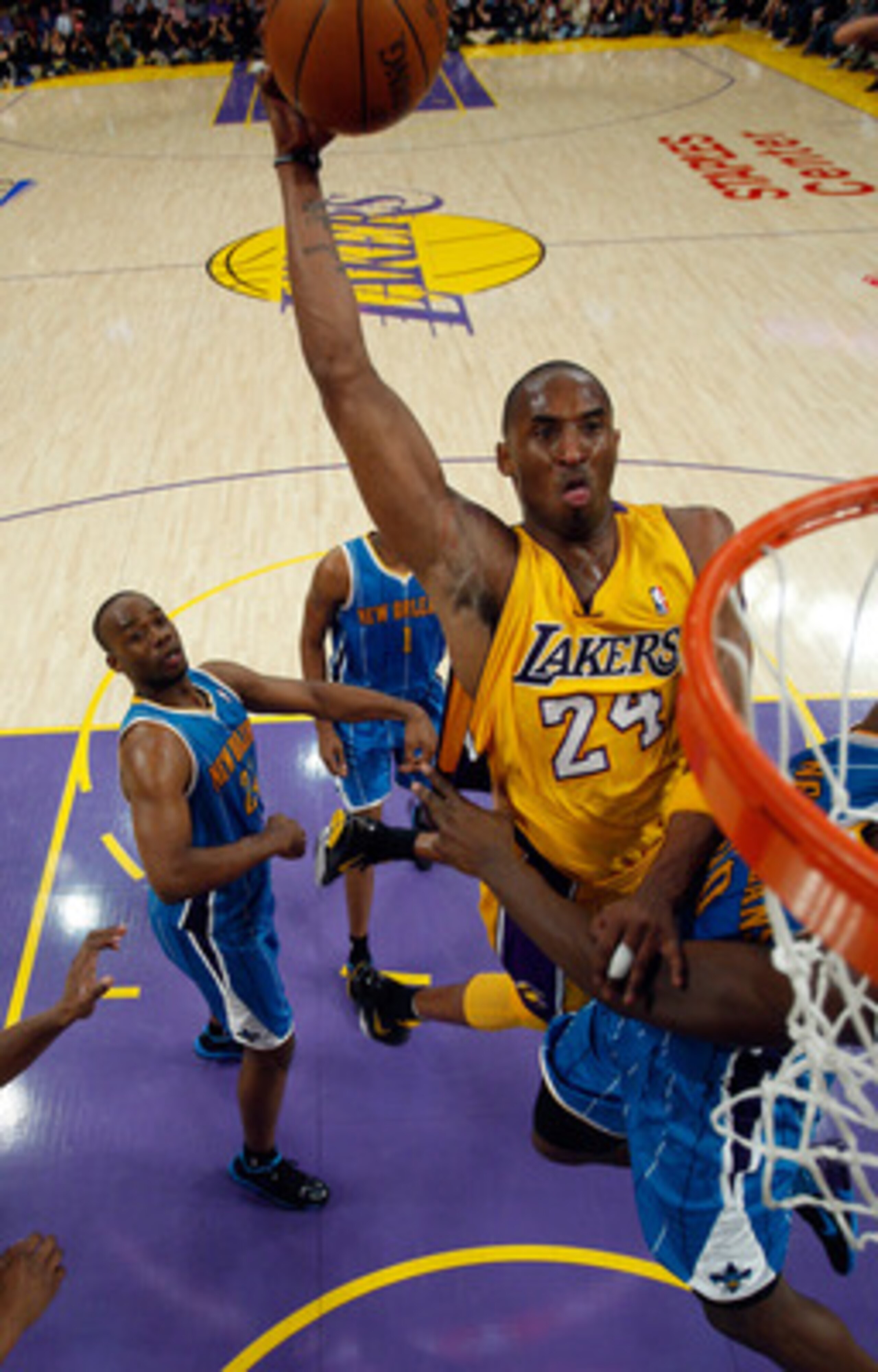 LOS ANGELES, CA - APRIL 26:  Kobe Bryant #24 of the Los Angeles Lakers dunks the ball over Emeka Okafor #50 of the New Orleans Hornets in the second quarter in Game Five of the Western Conference Quarterfinals in the 2011 NBA Playoffs on April 26, 2011 at