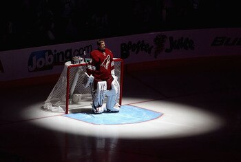 GLENDALE, AZ - APRIL 20:  Goaltender Ilya Bryzgalov #30 of the Phoenix Coyotes stands attended for the National Anthem before Game Four of the Western Conference Quarterfinals against the Detroit Red Wings during the 2011 NHL Stanley Cup Playoffs at Jobin