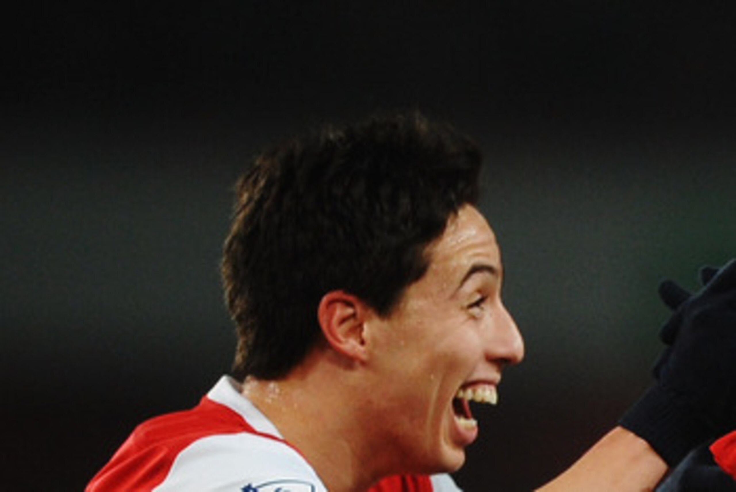 LONDON, UNITED KINGDOM - MARCH 02:  Gael Clichy (R) of Arsenal celebrates with team mate Samir Nasri (L) after scoring his sides fifth goal during the FA Cup sponsored by E.ON 5th Round Replay match between between Arsenal and Leyton Orient at the Emirate