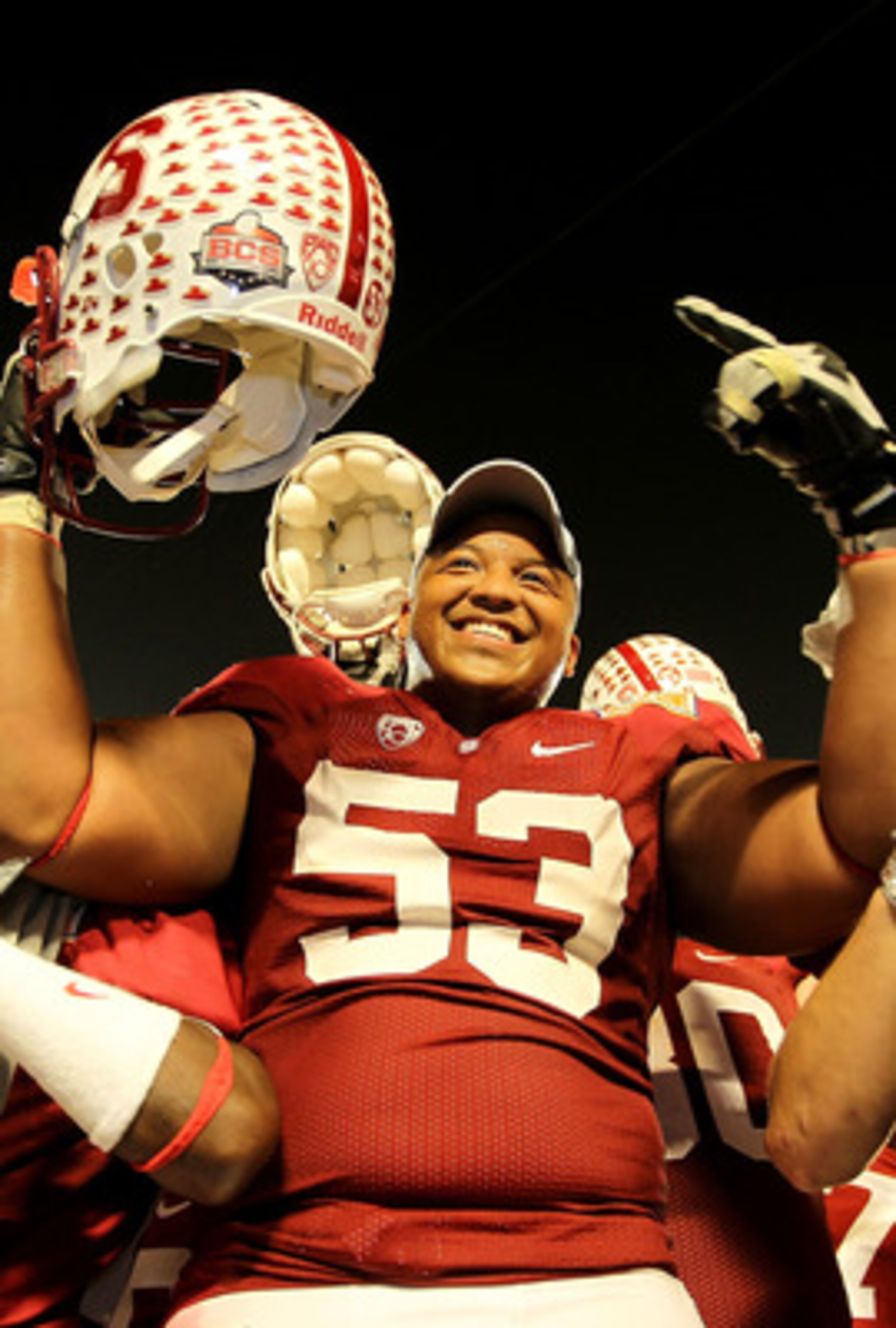MIAMI, FL - JANUARY 03: Derek Hall #53 of the Stanford Cardinal celebrates with teammates after Stanford won 40-12 against the Virginia Tech Hokies during the 2011 Discover Orange Bowl at Sun Life Stadium on January 3, 2011 in Miami, Florida. (Photo by Mi