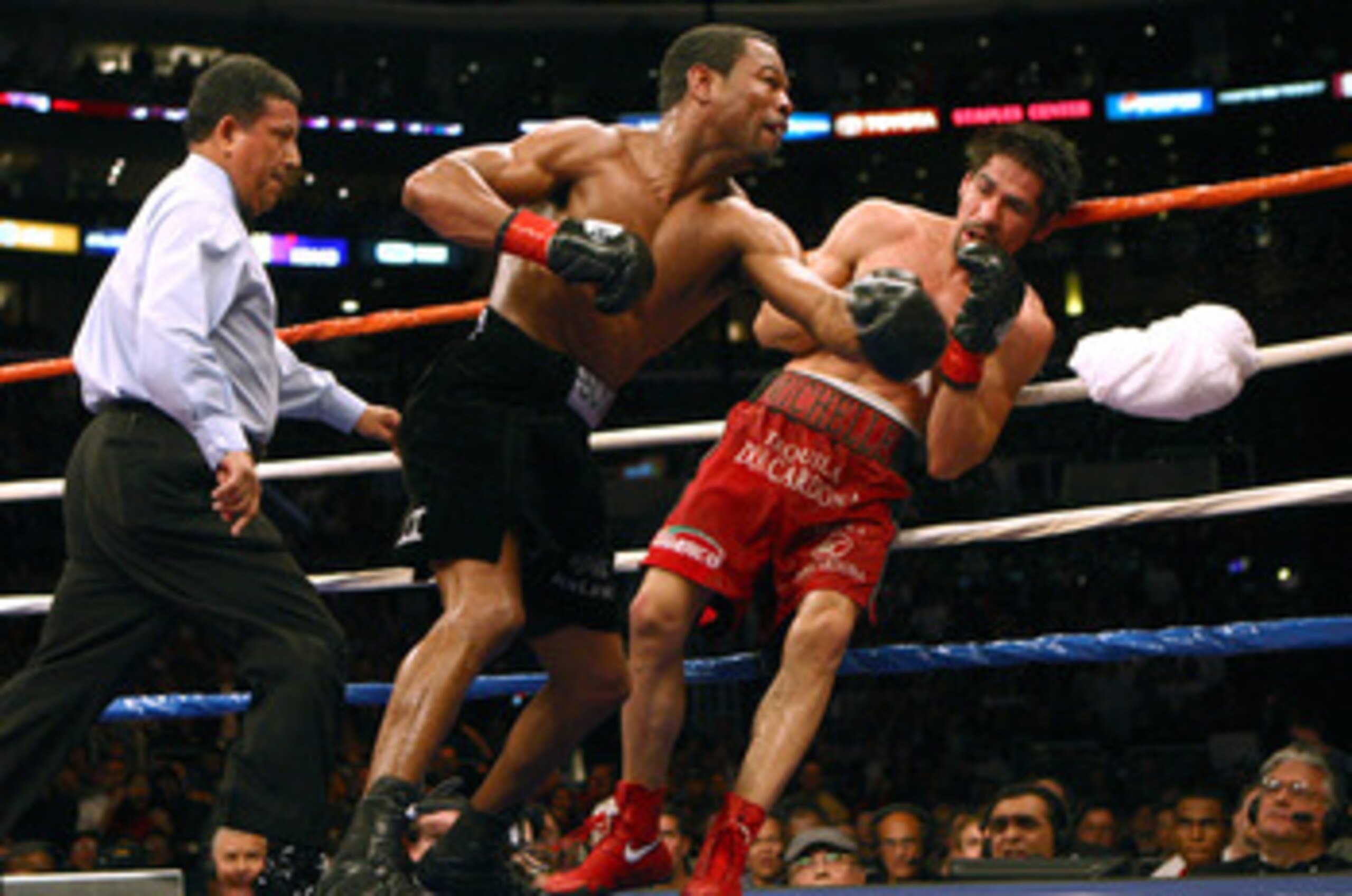 LOS ANGELES - JANUARY 24:   Shane Mosley lands a punch on Antonio Margarito as Margarito's corner throws in the towel en route to a TKO in the ninth round during their WBA welterweight title fight on January 24, 2009 at the Staples Center in Los Angeles,