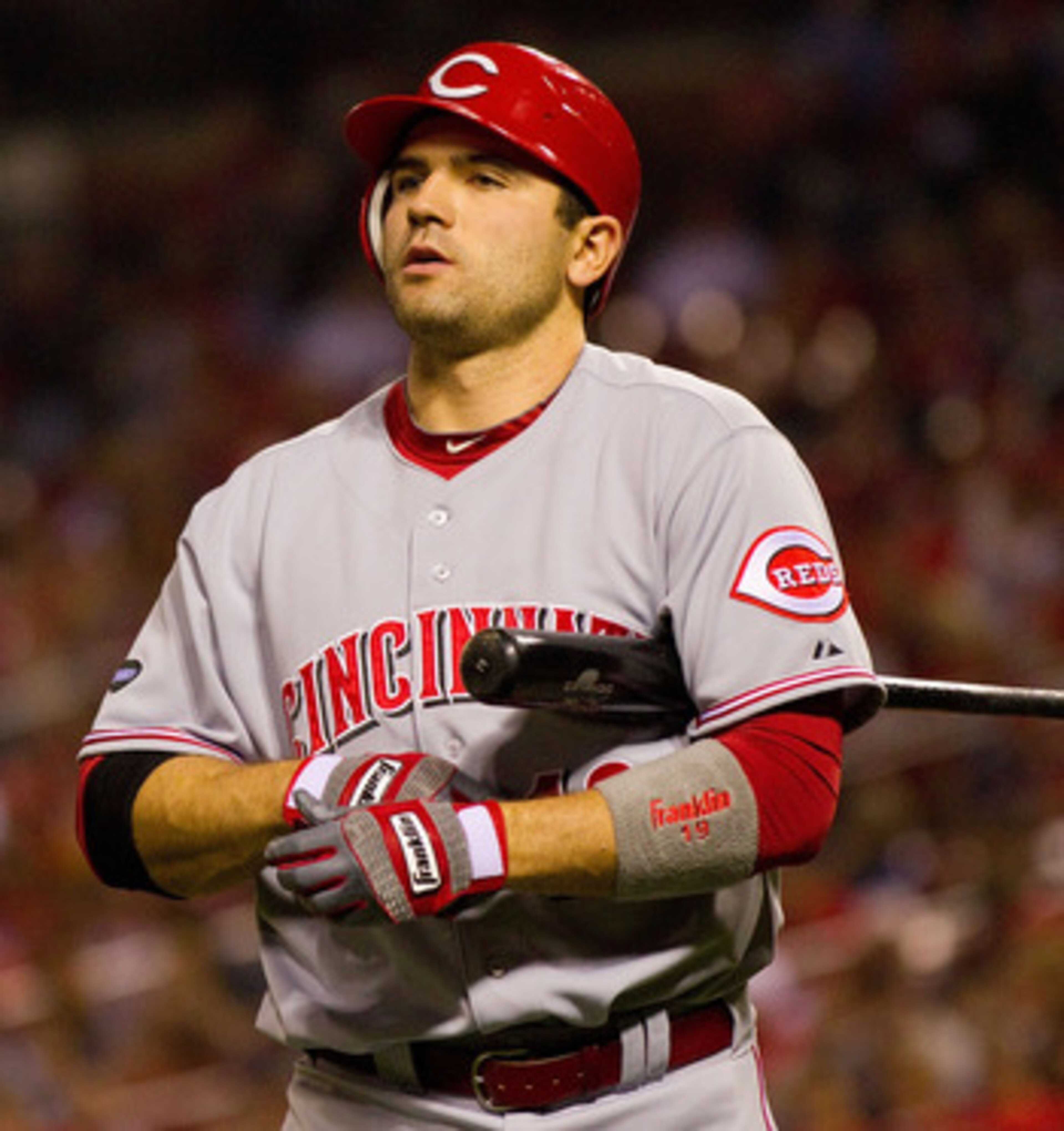 ST. LOUIS, MO - APRIL 22: Joey Votto #19 of the Cincinnati Reds returns to the dugout after striking out against the St. Louis Cardinals at Busch Stadium on April 22, 2011 in St. Louis, Missouri.  (Photo by Dilip Vishwanat/Getty Images)