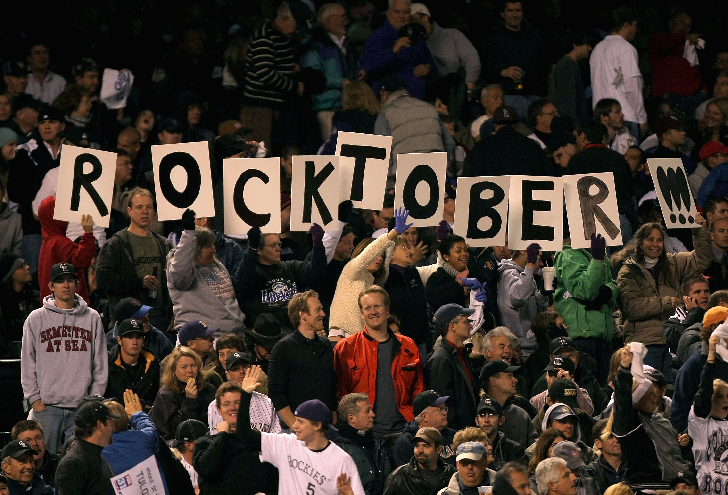 DENVER - OCTOBER 15:  Fans of the Colorado Rockies spell out 'Rocktober' in signs during Game Four of the National League Championship Series against the Arizona Diamondbacks at Coors Field on October 15, 2007 in Denver, Colorado.  (Photo by Harry How/Get