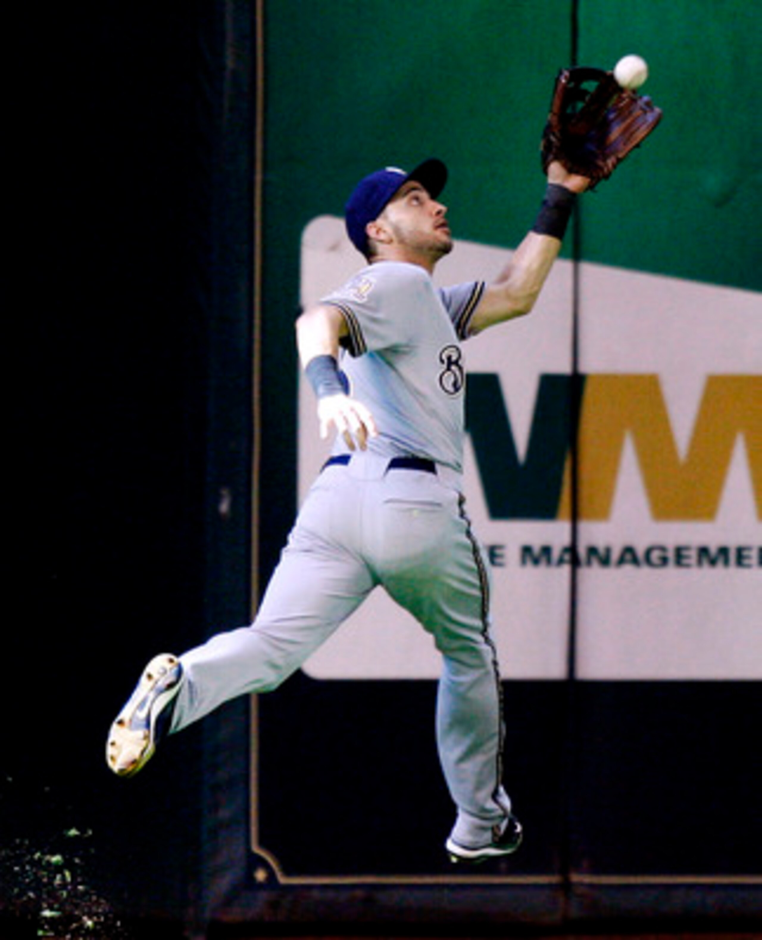 HOUSTON - SEPTEMBER 15:  Left fielder Ryan Braun #8 of the Milwaukee Brewers makes a running catch on a ball hit by Angel Sanchez of the Houston Astros in the ninth inning at Minute Maid Park on September 15, 2010 in Houston, Texas.  (Photo by Bob Levey/G