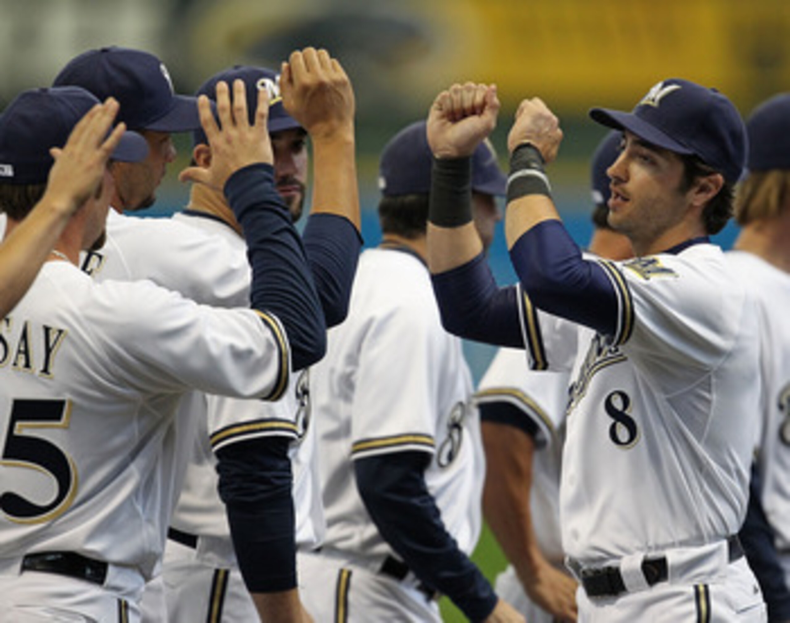 MILWAUKEE, WI - APRIL 04: Ryan Braun #8 of the Milwaukee Brewers greets teammates during player inrtoductions before the home opener against the Atlanta Braves at Miller Park on April 4, 2011 in Milwaukee, Wisconsin. The Braves defeated the Brewers 2-1. (