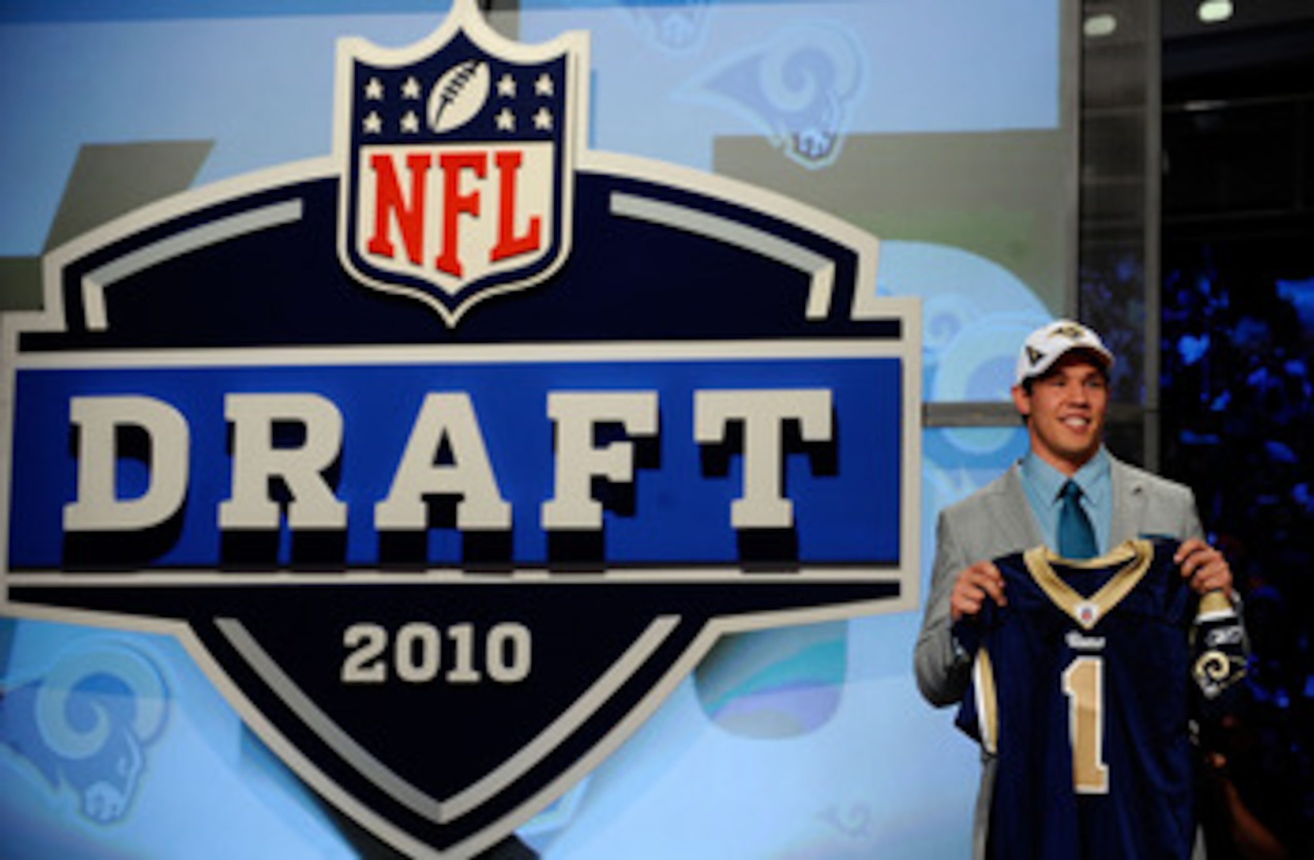 NEW YORK - APRIL 22:  Quarterback Sam Bradford of the Oklahoma Soomers holds up a St. Louis Rams jersey after he was picked numer 1 overall by the Rams during the 2010 NFL Draft at Radio City Music Hall on April 22, 2010 in New York City.  (Photo by Jeff