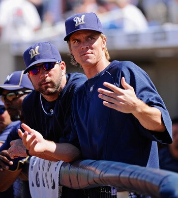 PHOENIX, AZ - MARCH 10:  Pitchers Zack Greinke #13 and Shaun Marcum #18  of the Milwaukee Brewers look at fans during the spring teaining baseball agme against Colorado Rockies at Maryvale Baseball Park on March 10, 2011 in Phoenix, Arizona.  (Photo by Ke