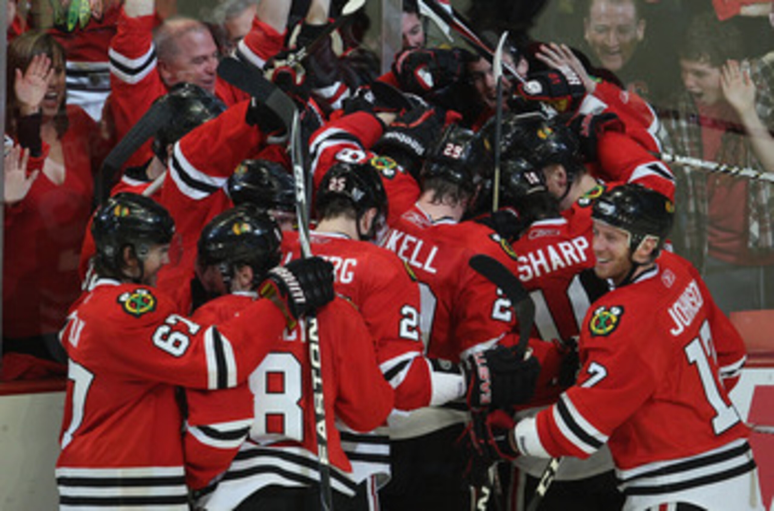 CHICAGO, IL - APRIL 24: Members of the Chicago Blackhawks celebrate an overtime win against the Vancouver Canucks in Game Six of the Western Conference Quarterfinals during the 2011 NHL Stanley Cup Playoffs at the United Center on April 24, 2011 in Chicag CHICAGO, IL - APRIL 24: Members of the Chicago Blackhawks celebrate an overtime win against the Vancouver Canucks in Game Six of the Western Conference Quarterfinals during the 2011 NHL Stanley Cup Playoffs at the United Center on April 24, 2011 in Chicag