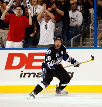 TAMPA, FL - APRIL 20: Martin St. Louis #26 of the Tampa Bay Lightning celebrates a goal against the Pittsburgh Penguins in Game Four of the Eastern Conference Quarterfinals during the 2011 NHL Stanley Cup Playoffs at the St. Pete Times Forum on April 20,