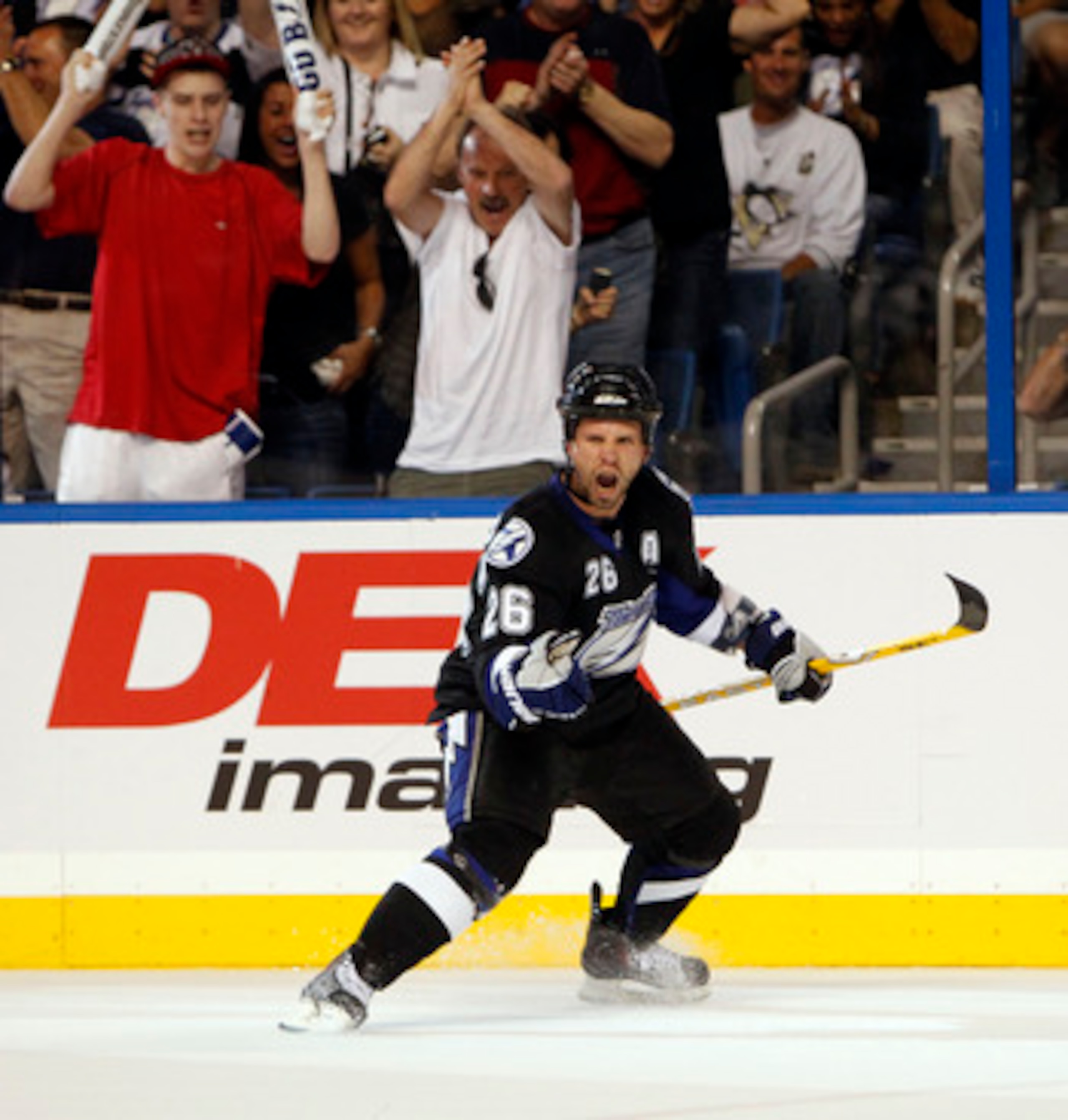 TAMPA, FL - APRIL 20: Martin St. Louis #26 of the Tampa Bay Lightning celebrates a goal against the Pittsburgh Penguins in Game Four of the Eastern Conference Quarterfinals during the 2011 NHL Stanley Cup Playoffs at the St. Pete Times Forum on April 20, TAMPA, FL - APRIL 20: Martin St. Louis #26 of the Tampa Bay Lightning celebrates a goal against the Pittsburgh Penguins in Game Four of the Eastern Conference Quarterfinals during the 2011 NHL Stanley Cup Playoffs at the St. Pete Times Forum on April 20,