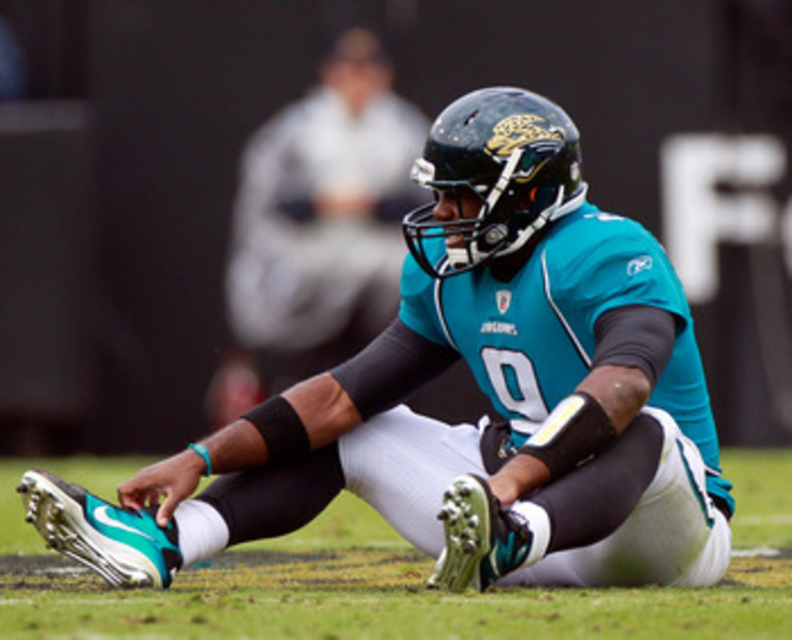 JACKSONVILLE, FL - DECEMBER 12:  Quarterback David Garrard #9 of the Jacksonville Jaguars sits on the ground after a sack during the game against the Oakland Raiders at EverBank Field on December 12, 2010 in Jacksonville, Florida.  (Photo by Sam Greenwood