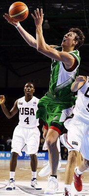 AUCKLAND, NEW ZEALAND - JULY 08:  Donatas Motiejunas of Lithuania takes the ball to the hoop as Seth Curry of the United States defends during the U19 Basketball World Championships match between the United States and Lithuania at North Shore Events Centr