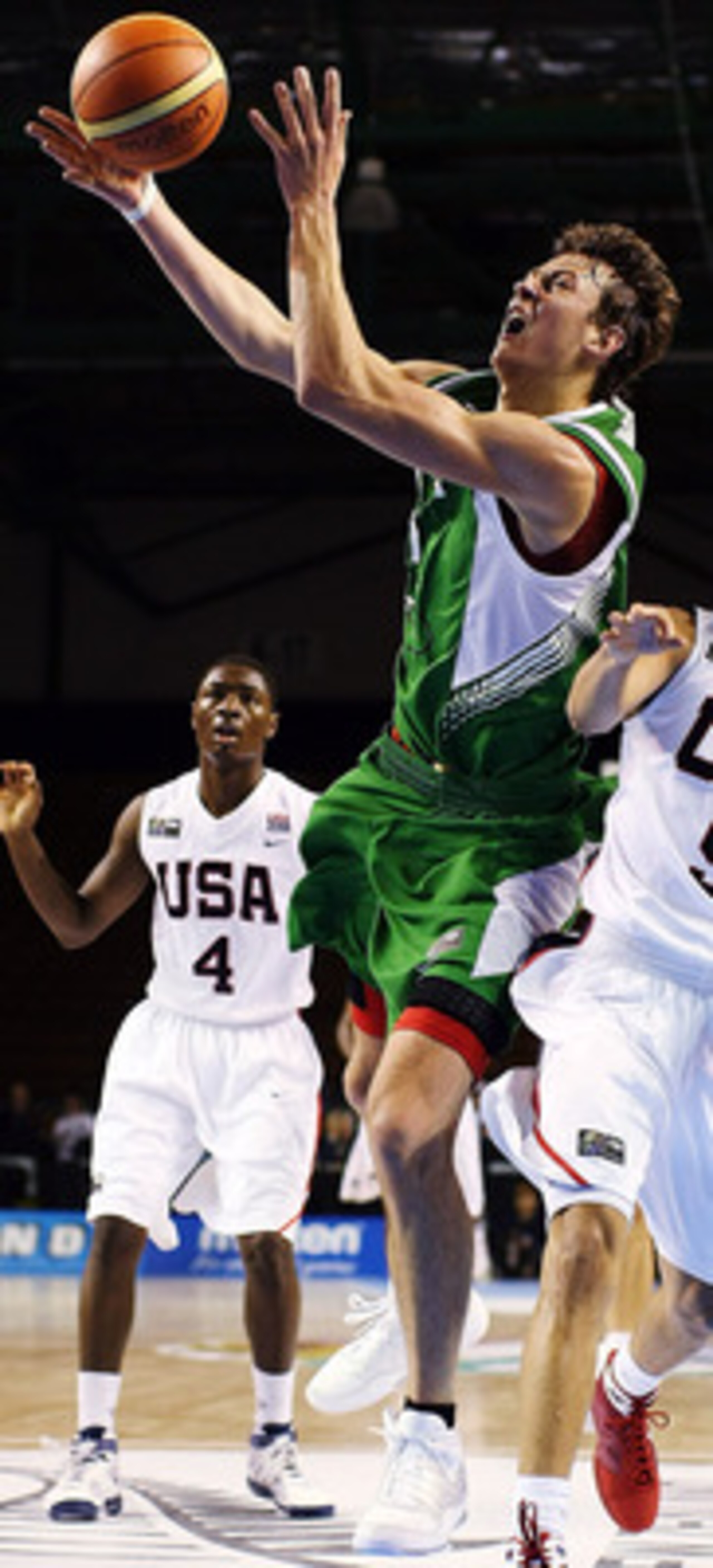 AUCKLAND, NEW ZEALAND - JULY 08:  Donatas Motiejunas of Lithuania takes the ball to the hoop as Seth Curry of the United States defends during the U19 Basketball World Championships match between the United States and Lithuania at North Shore Events Centr