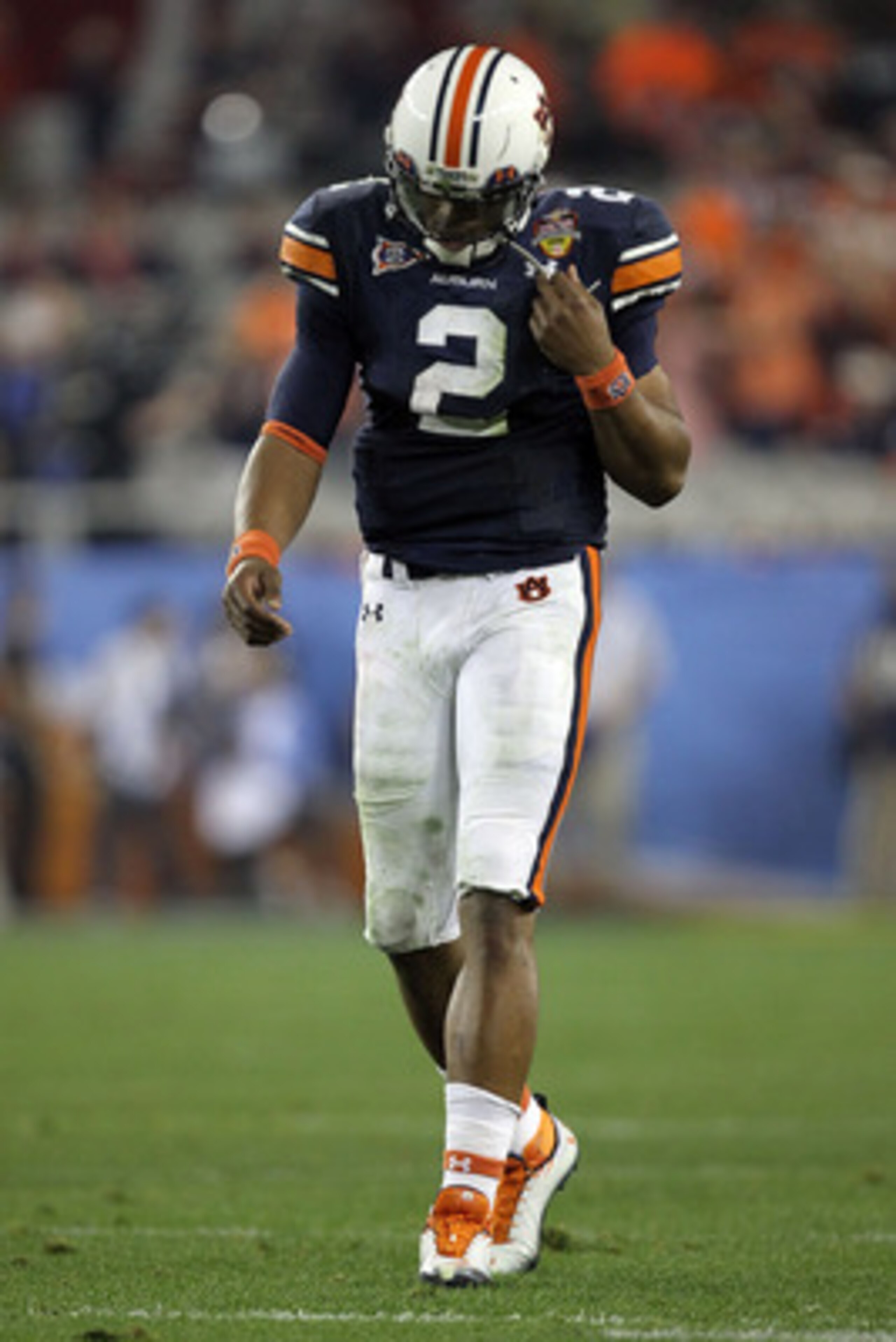 GLENDALE, AZ - JANUARY 10:  Quarterback Cameron Newton #2 of the Auburn Tigers walks off the field in the second quarter against the Oregon Ducks during the Tostitos BCS National Championship Game at University of Phoenix Stadium on January 10, 2011 in Gl