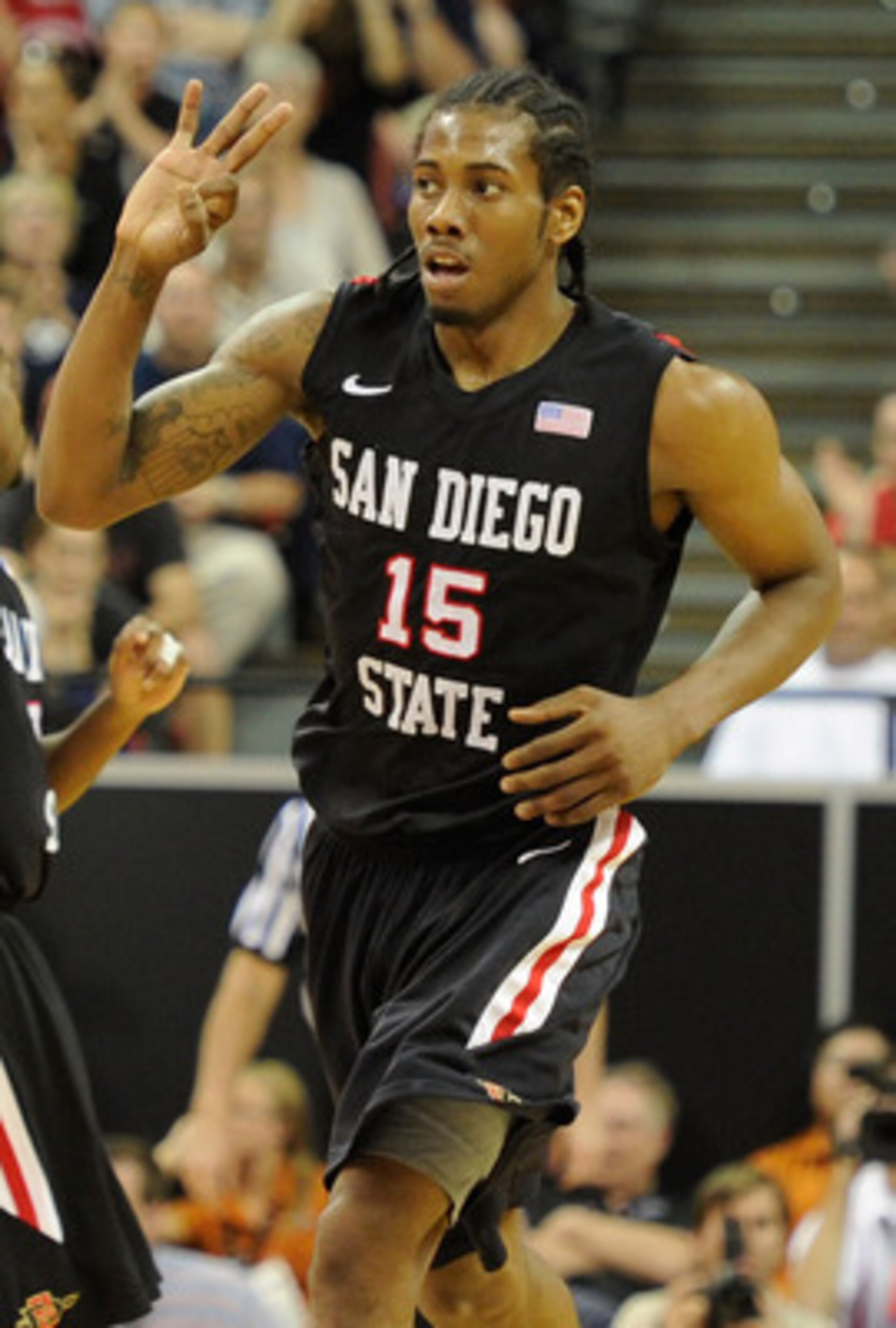 LAS VEGAS, NV - MARCH 12:  Kawhi Leonard #15 of the San Diego State Aztecs holds up three fingers after scoring a three-point basket against the Brigham Young University Cougars during the championship game of the Conoco Mountain West Conference Basketbal